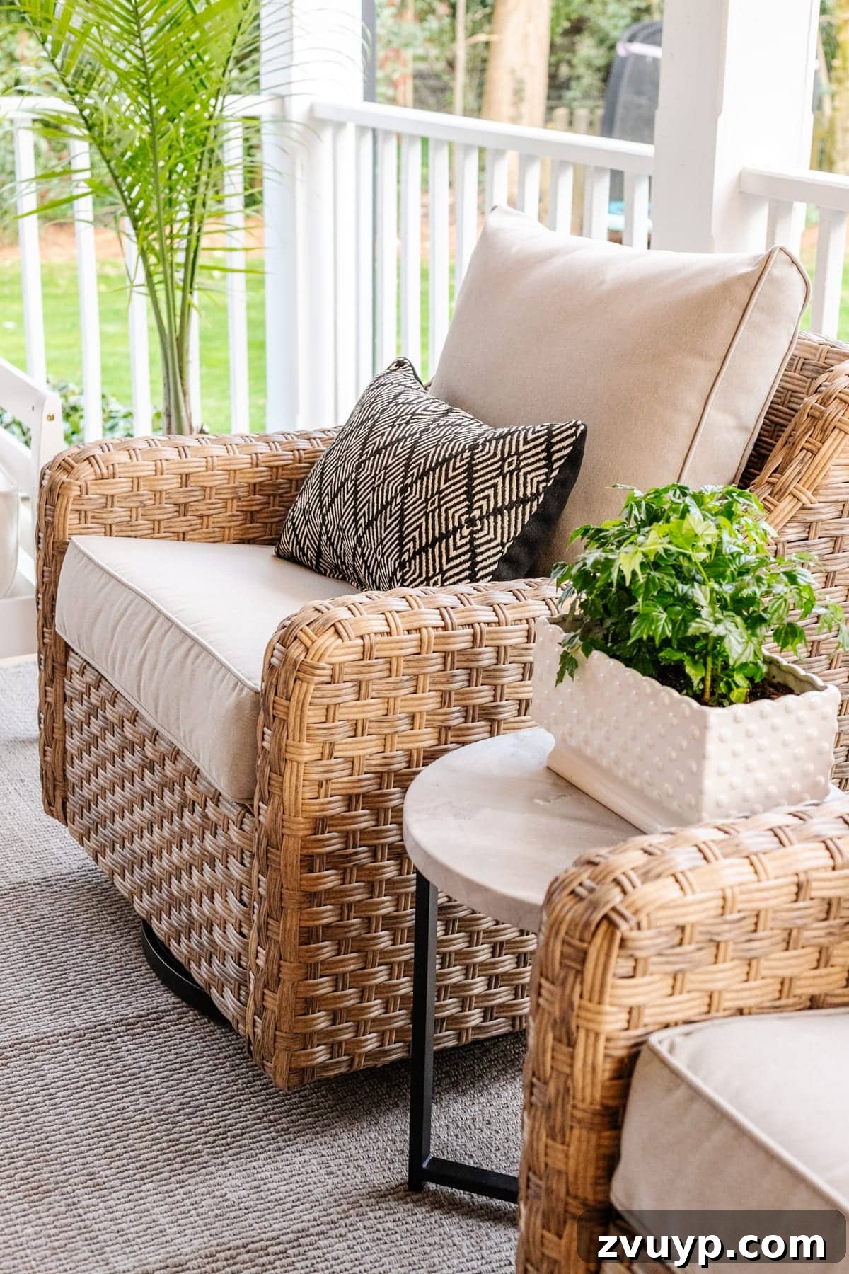 Revitalizing Our Outdoor Retreat 4 A close-up of a plush, comfortable outdoor swivel chair, highlighting its inviting design.