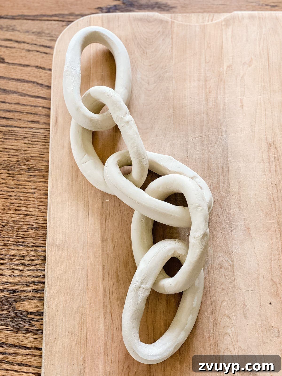 Sculpt Your Own Stylish Clay Chains 6 Process of interlocking air dry clay links to form a decorative chain