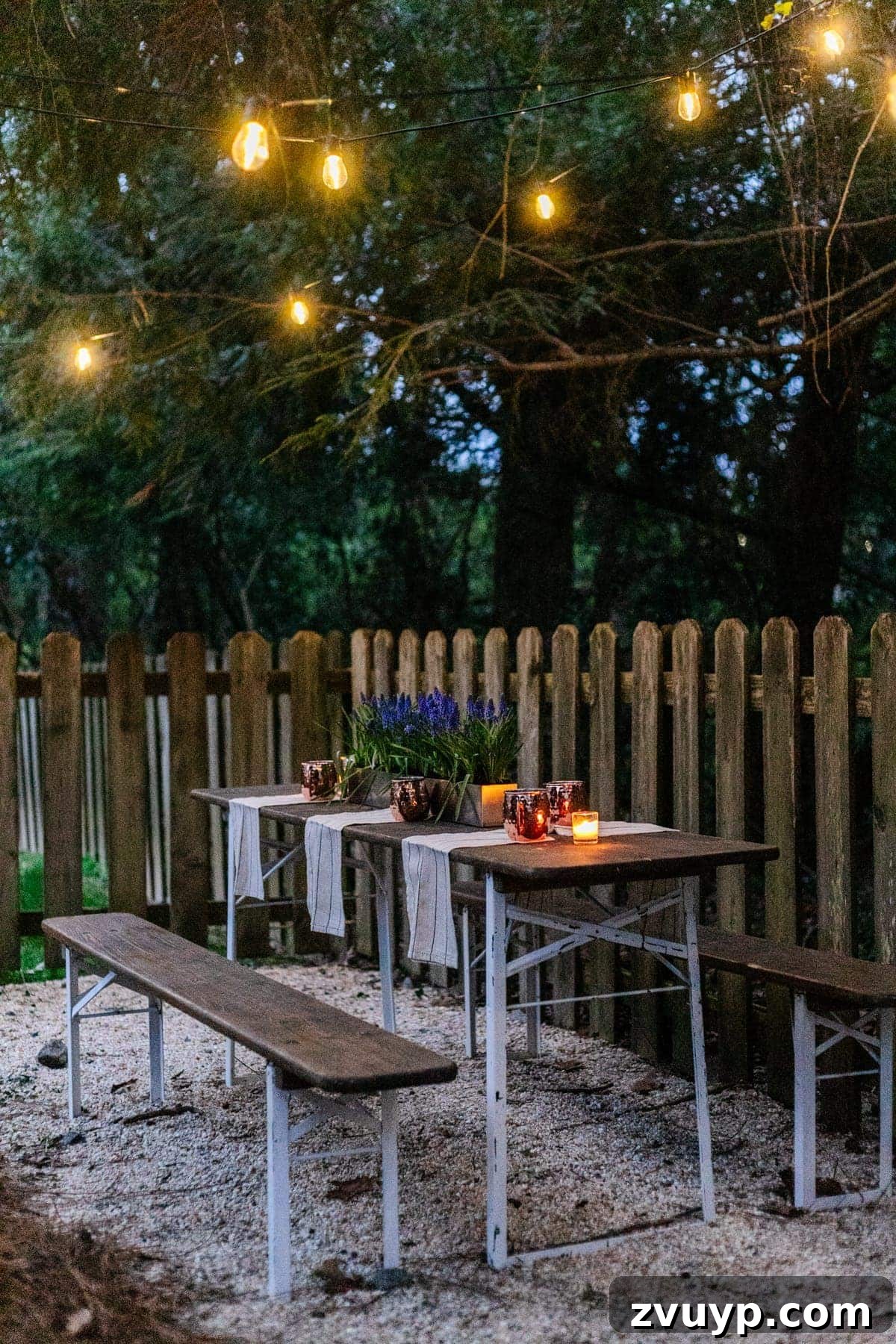 Brewing a Backyard Haven: DIY from Neglect 7 folding table and string lights on pea gravel for an inexpensive backyard patio area