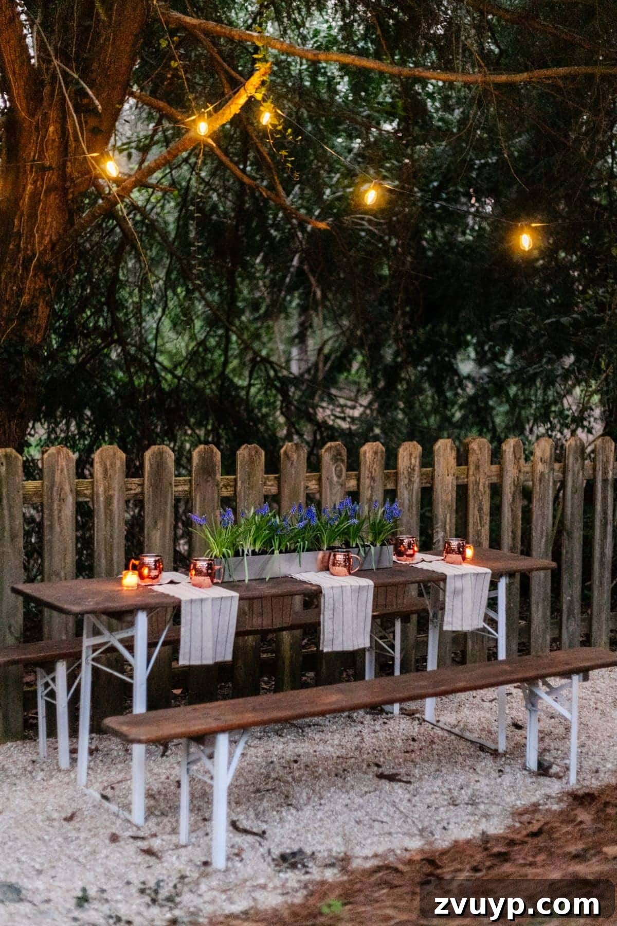 Brewing a Backyard Haven: DIY from Neglect 8 hanging solar string lights in trees above a folding table to make a backyard beer garden dining area