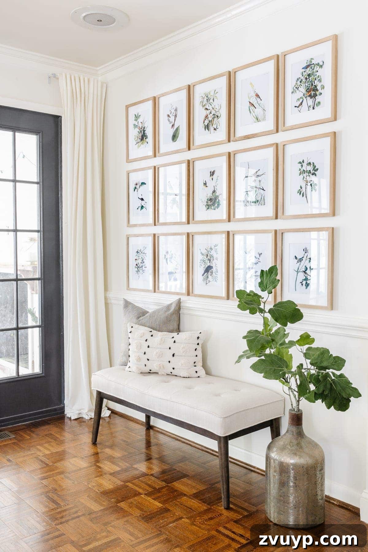 Audubon's Avian Art: Free Printable Gallery for Your Walls 6 Well-styled entryway featuring a spring gallery wall with Audubon bird prints, a wooden bench, and a modern lamp.