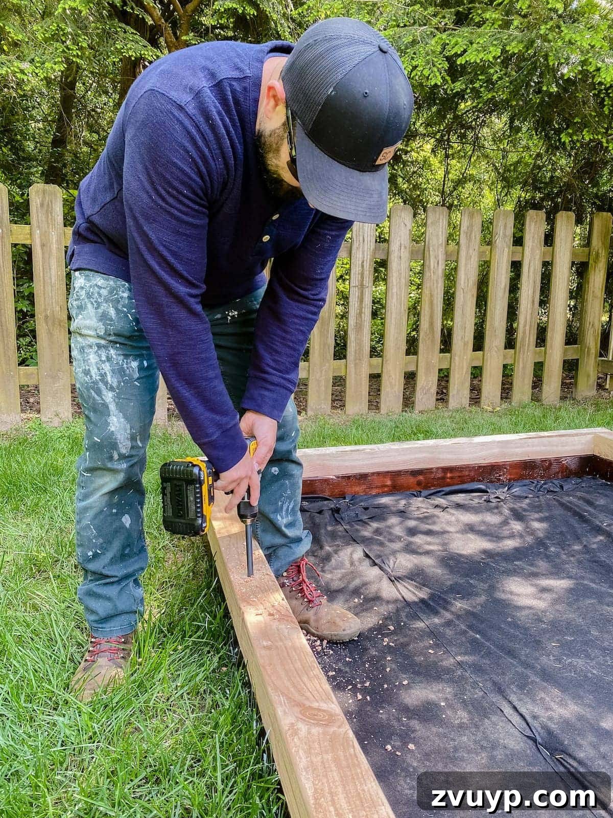Get Rolling Build a Bocce Court in a Weekend 18 Drilling pilot holes for rebar spikes to anchor the bocce ball court frame