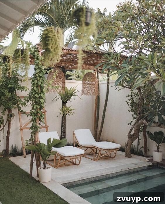 7 Pool Cabana Ideas for Your Backyard Oasis 5 A serene boho pool cabana adorned with rattan and bamboo furniture, surrounded by lush tropical foliage, offering a peaceful retreat.