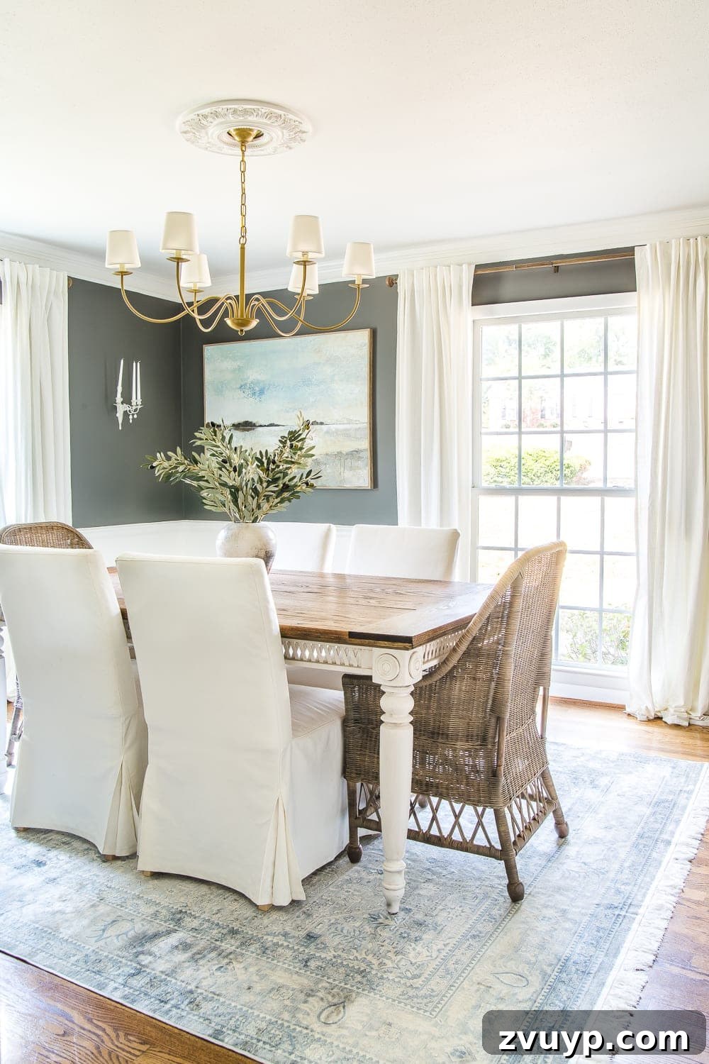 Elevating Our Dining Room: A Modern Classic Refresh 2 Elegant dining room featuring Kendall Charcoal walls, slipcovered dining chairs, and a refined aesthetic.