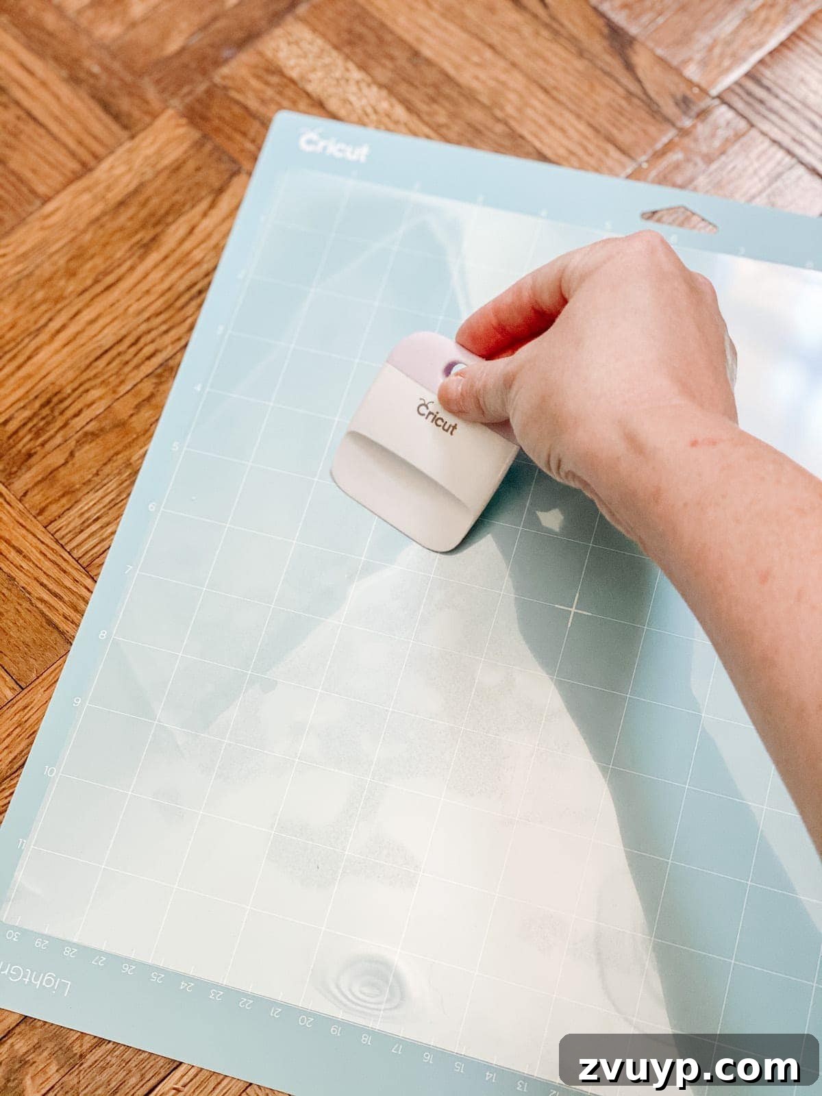 Craft a Custom Floral Outdoor Rug with a Cricut Stencil 11 Placing acetate sheet onto Cricut Light Grip mat before loading into machine