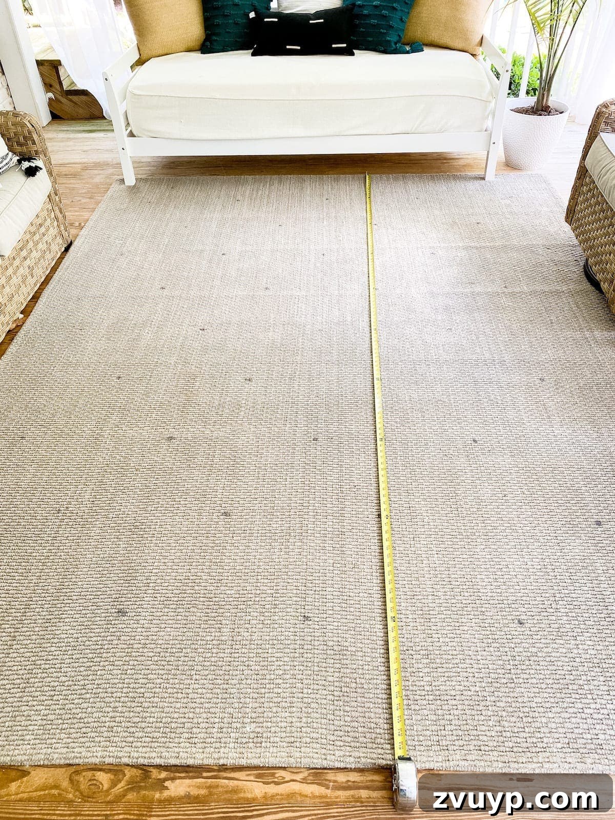 Craft a Custom Floral Outdoor Rug with a Cricut Stencil 18 Close-up view of a tape measure and washable marker creating a grid on an outdoor rug