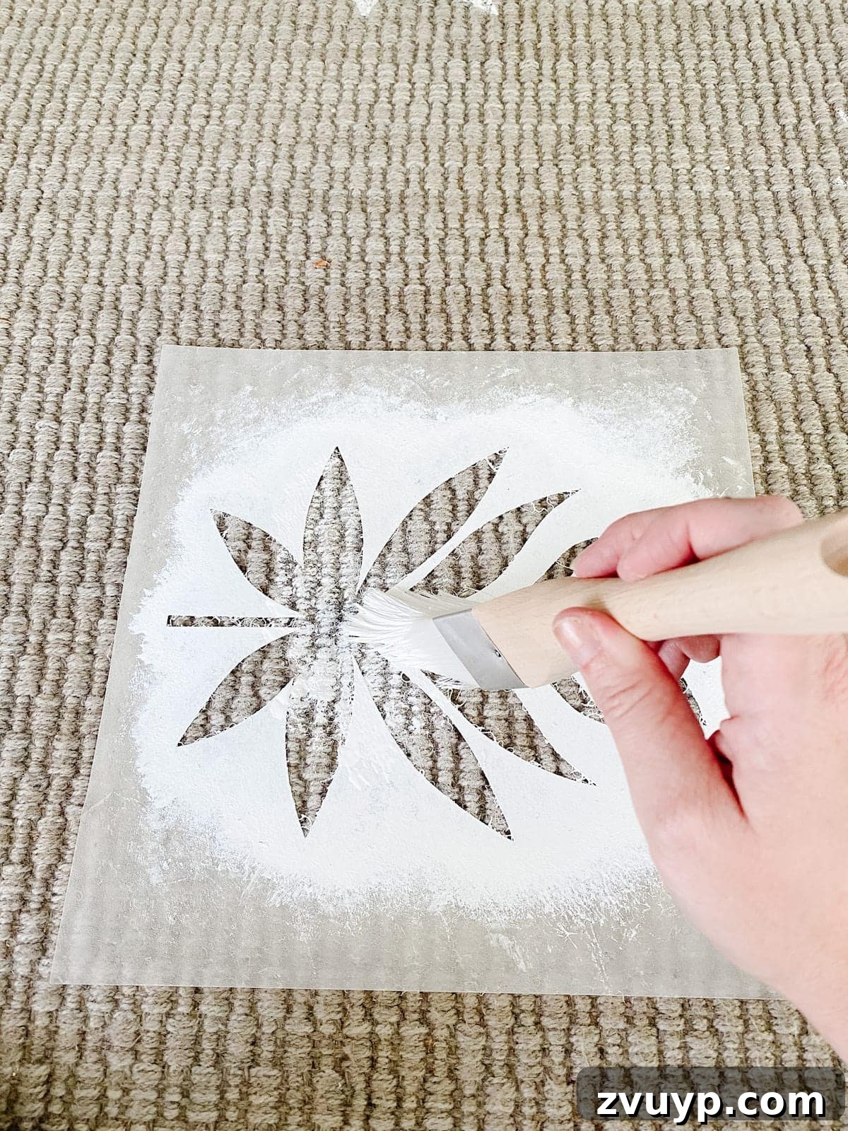 Craft a Custom Floral Outdoor Rug with a Cricut Stencil 20 Applying paint to the floral stencil with a pouncing motion on the outdoor rug