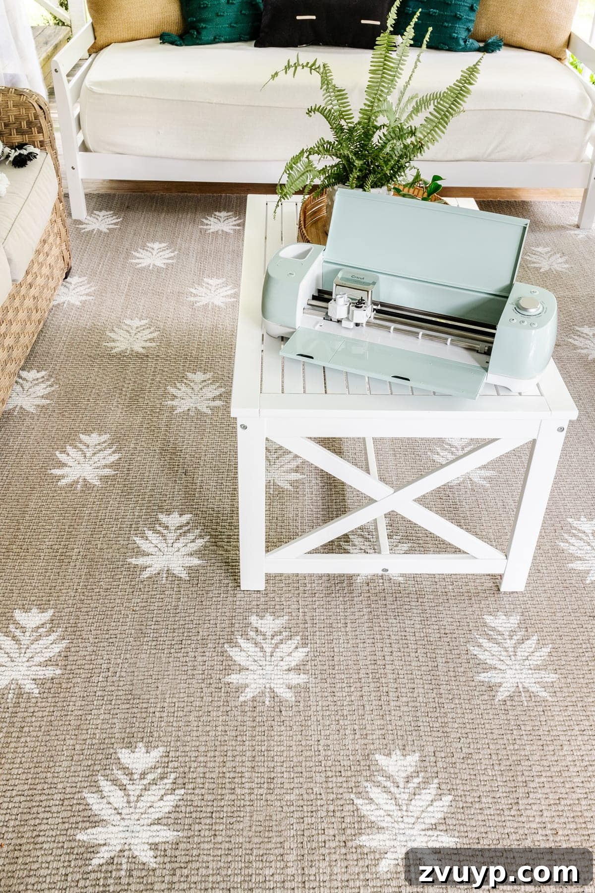 Craft a Custom Floral Outdoor Rug with a Cricut Stencil 26 The custom stenciled outdoor rug featured as part of a stylish back porch seating arrangement
