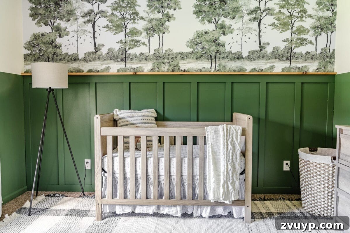 Little Explorer's Woodland Nursery Transformation 4 An inviting green nursery designed for a baby boy, featuring a rustic wooden crib and a nature-inspired wall mural.