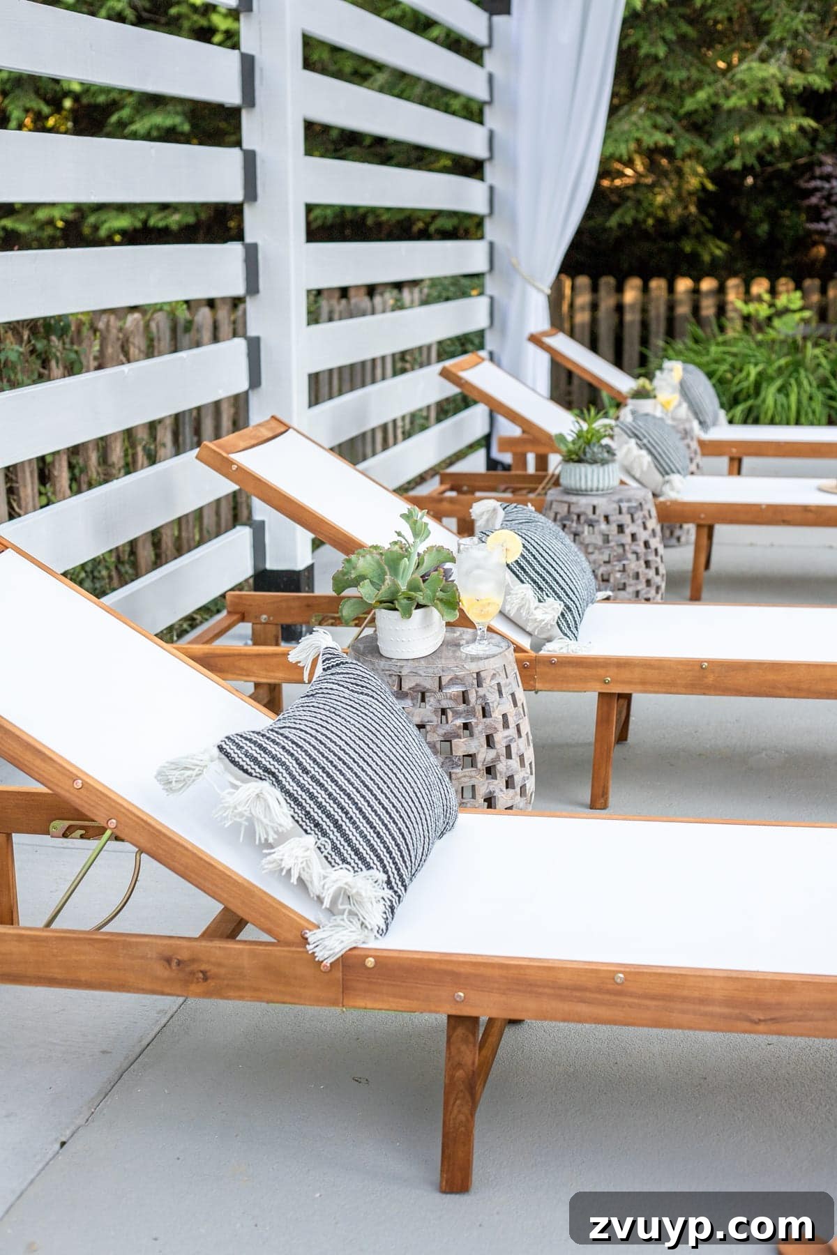 Build Your Own Backyard Oasis: A DIY Luxury Pool Cabana Pergola 11 outdoor lounge chairs under white pergola with outdoor curtains and pillows for added comfort