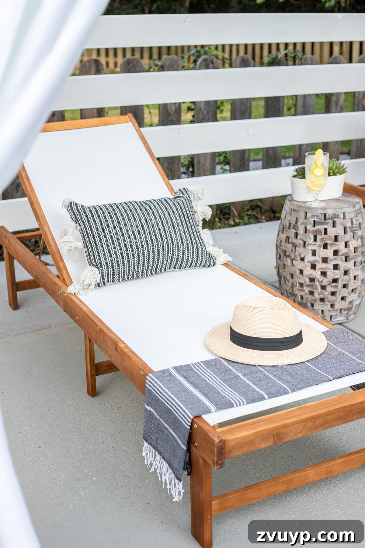 Build Your Own Backyard Oasis: A DIY Luxury Pool Cabana Pergola 12 outdoor lounge chair with pillow, Turkish towel, and sun hat, ready for a day by the pool
