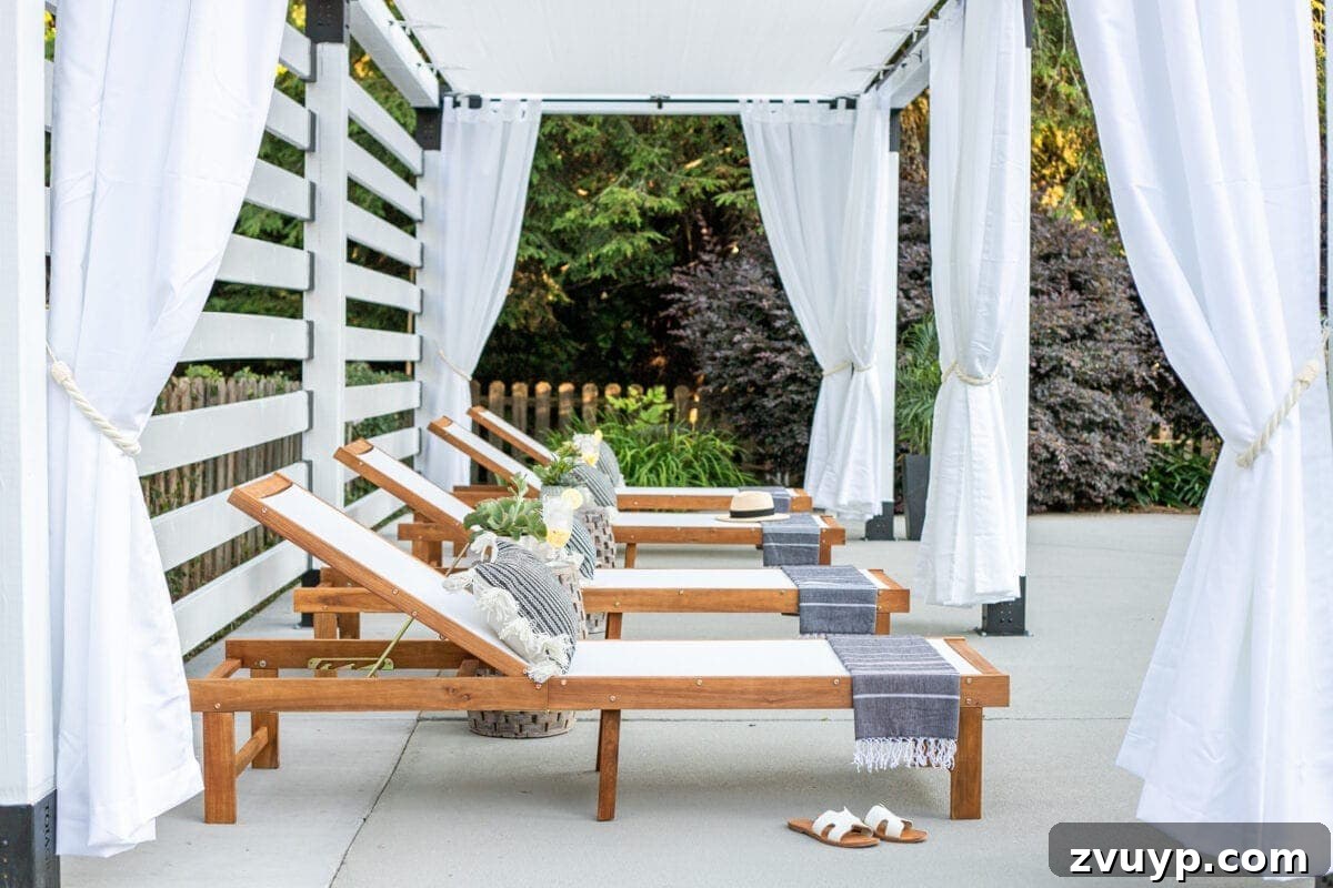 Build Your Own Backyard Oasis: A DIY Luxury Pool Cabana Pergola 14 white DIY pergola cabana with outdoor curtains and lounge chairs, showcasing the full setup