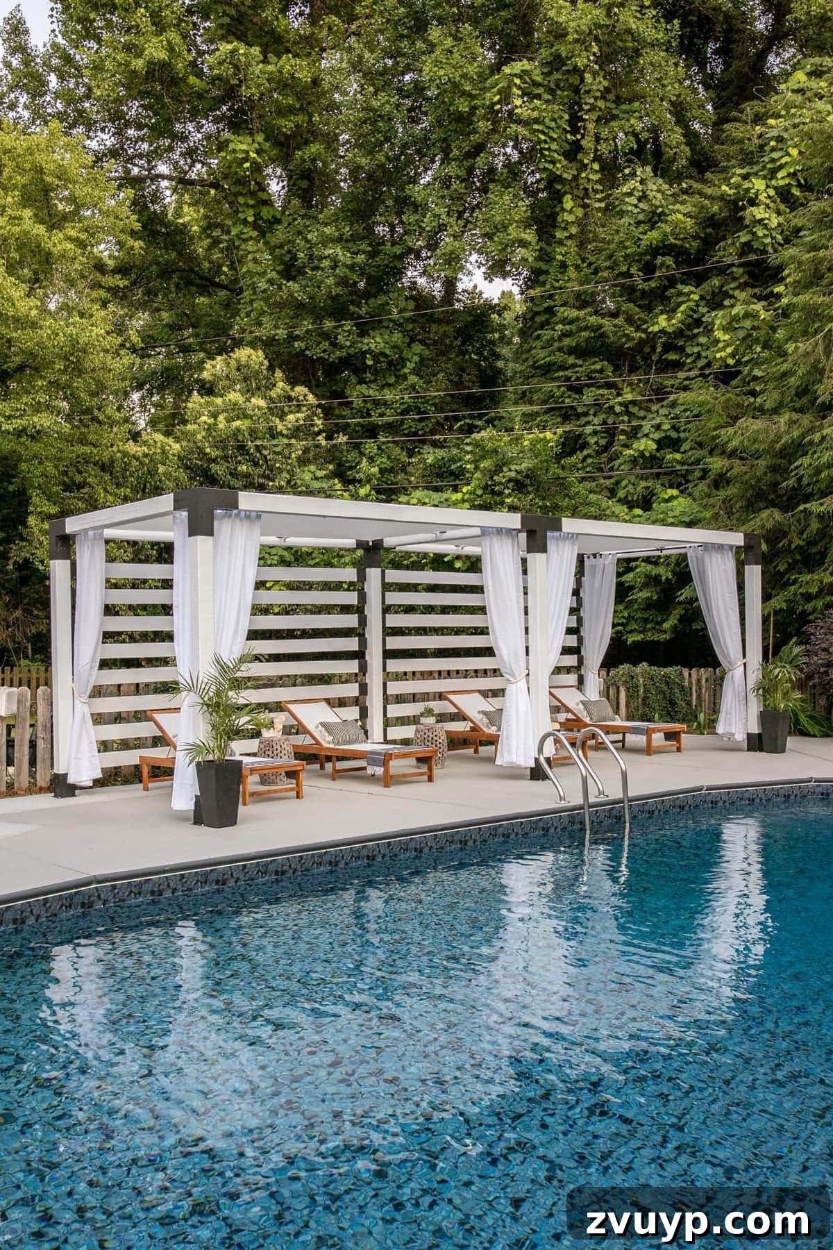 Build Your Own Backyard Oasis: A DIY Luxury Pool Cabana Pergola 9 white DIY pergola cabana with outdoor curtains and lounge chairs, close-up of draped curtains