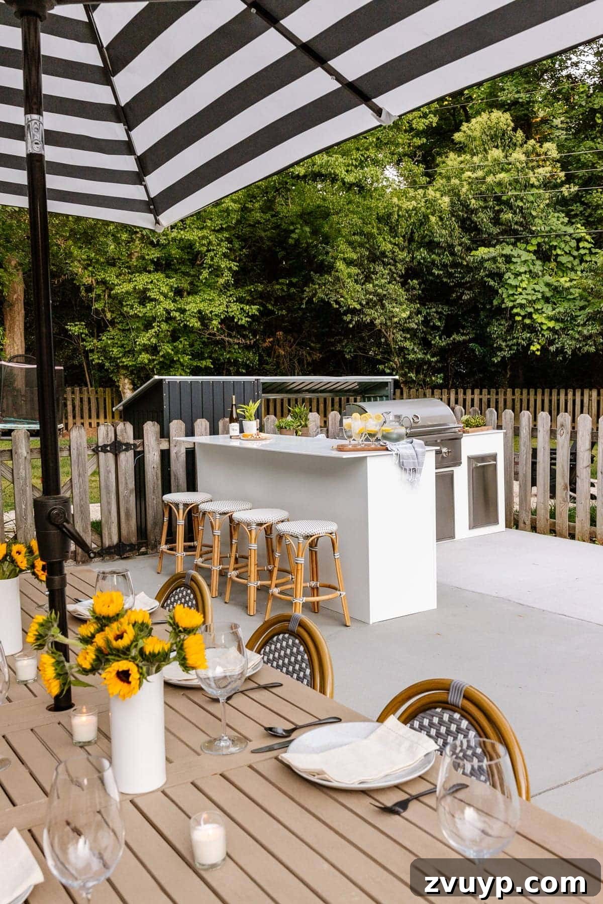 Effortless DIY Outdoor Kitchen Kit Build: Essential Tips 22 Another view of the white modular outdoor kitchen and outdoor living space, highlighting its seamless integration into the backyard.