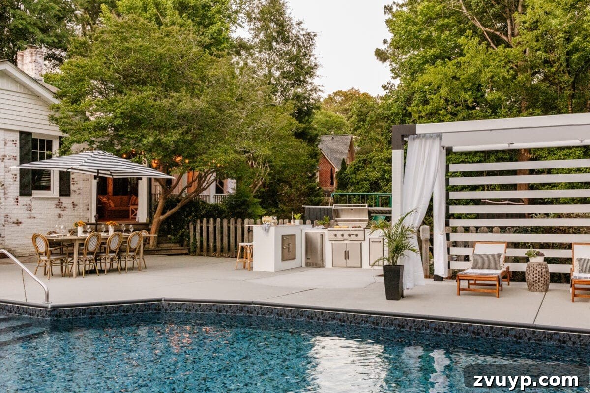Effortless DIY Outdoor Kitchen Kit Build: Essential Tips 23 The fully transformed backyard, showcasing the pool, modular outdoor kitchen, pergola cabana, and outdoor dining table as a cohesive living space.
