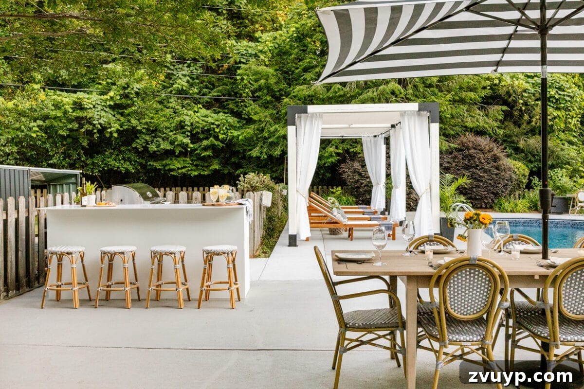 Effortless DIY Outdoor Kitchen Kit Build: Essential Tips 4 Luxurious pergola cabana, modular outdoor kitchen, and outdoor dining table complementing a swimming pool in a beautifully designed backyard.