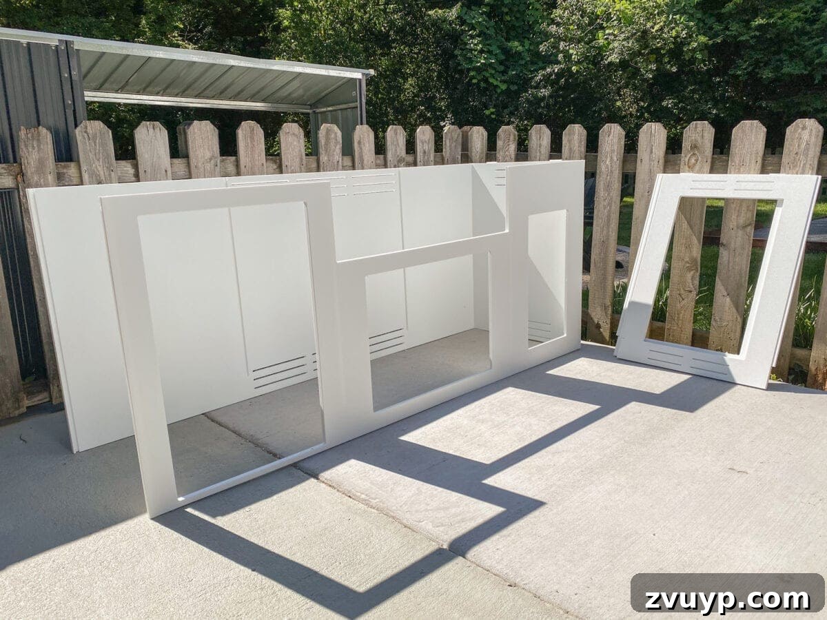 Effortless DIY Outdoor Kitchen Kit Build: Essential Tips 9 Two people assembling the modular outdoor kitchen frame with ease, showcasing the interlocking design and lightweight materials.