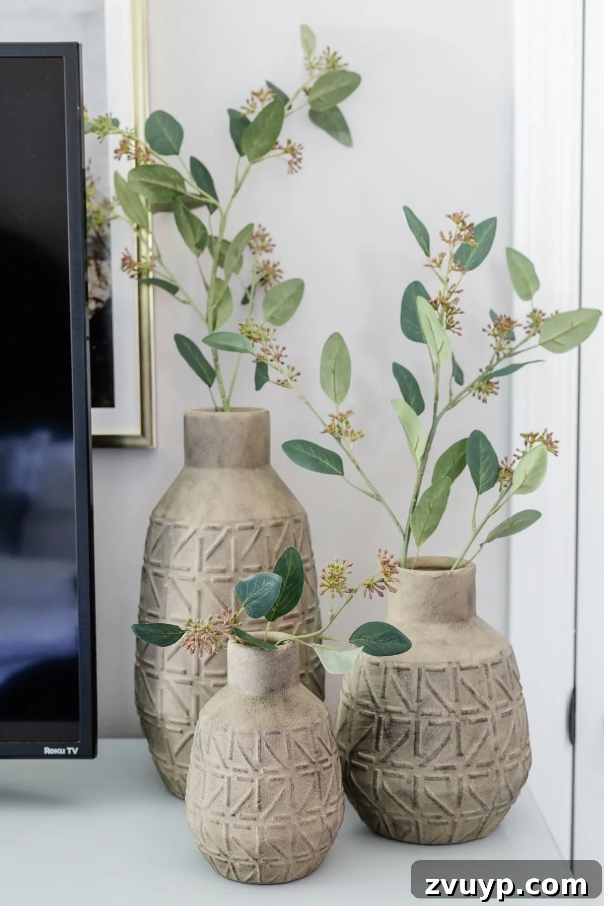 Small Space, Big Impact: 10 Bedroom Design Secrets 14 3 vases with stems on dresser decor in bedroom