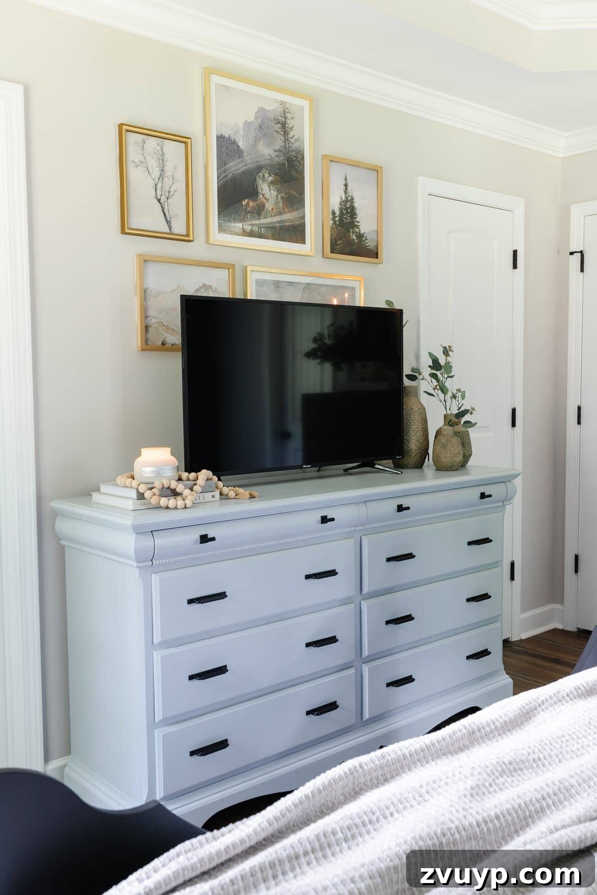 Small Space, Big Impact: 10 Bedroom Design Secrets 4 small bedroom with tv on blue painted dresser and gallery wall decor
