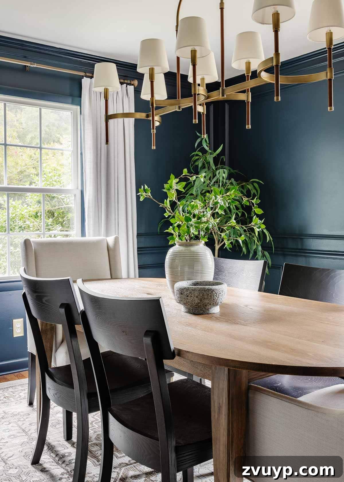 Bassett BenchMade Classic Modern Dining Refined 3 Elegant classic modern dining room with navy walls, linen curtains, a wood oval dining table, and black dining chairs