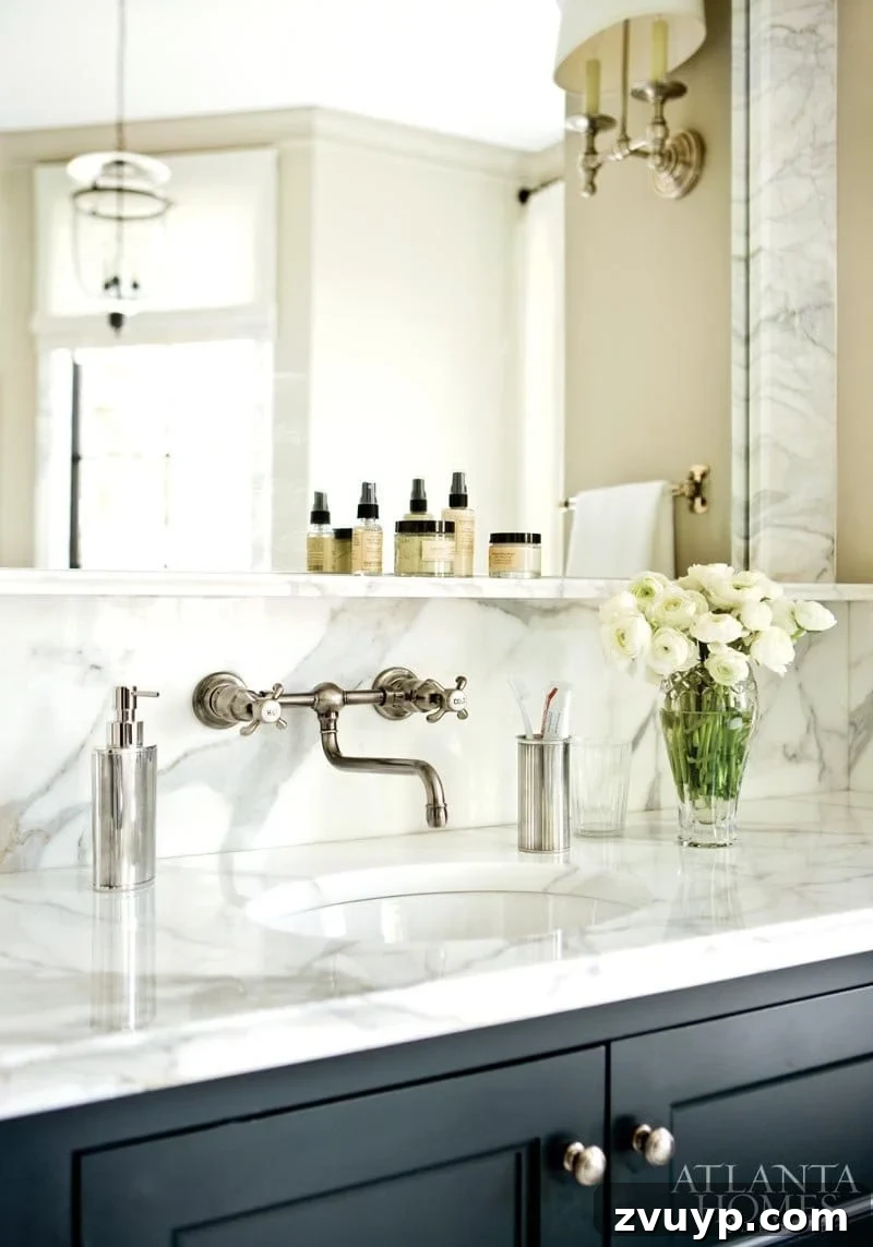 Our Timeless Bathroom Design Blueprint 8 Inspirational image of a classic bathroom with a marble backsplash and sink ledge.