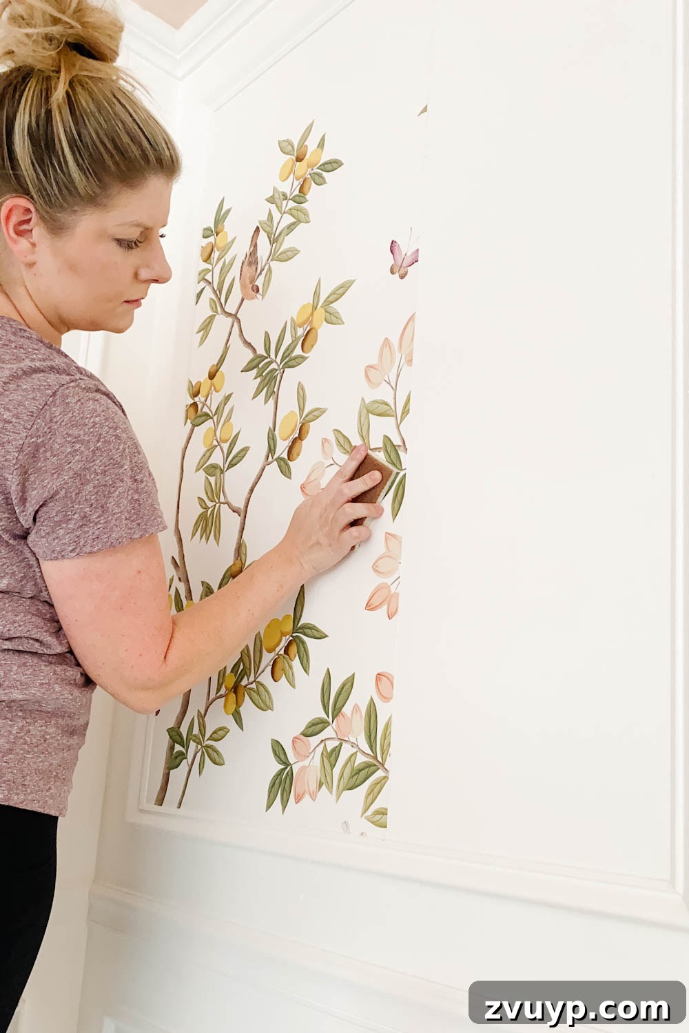 Transforming Walls with Framed Wallpaper Inserts 14 wiping down pasted wallpaper