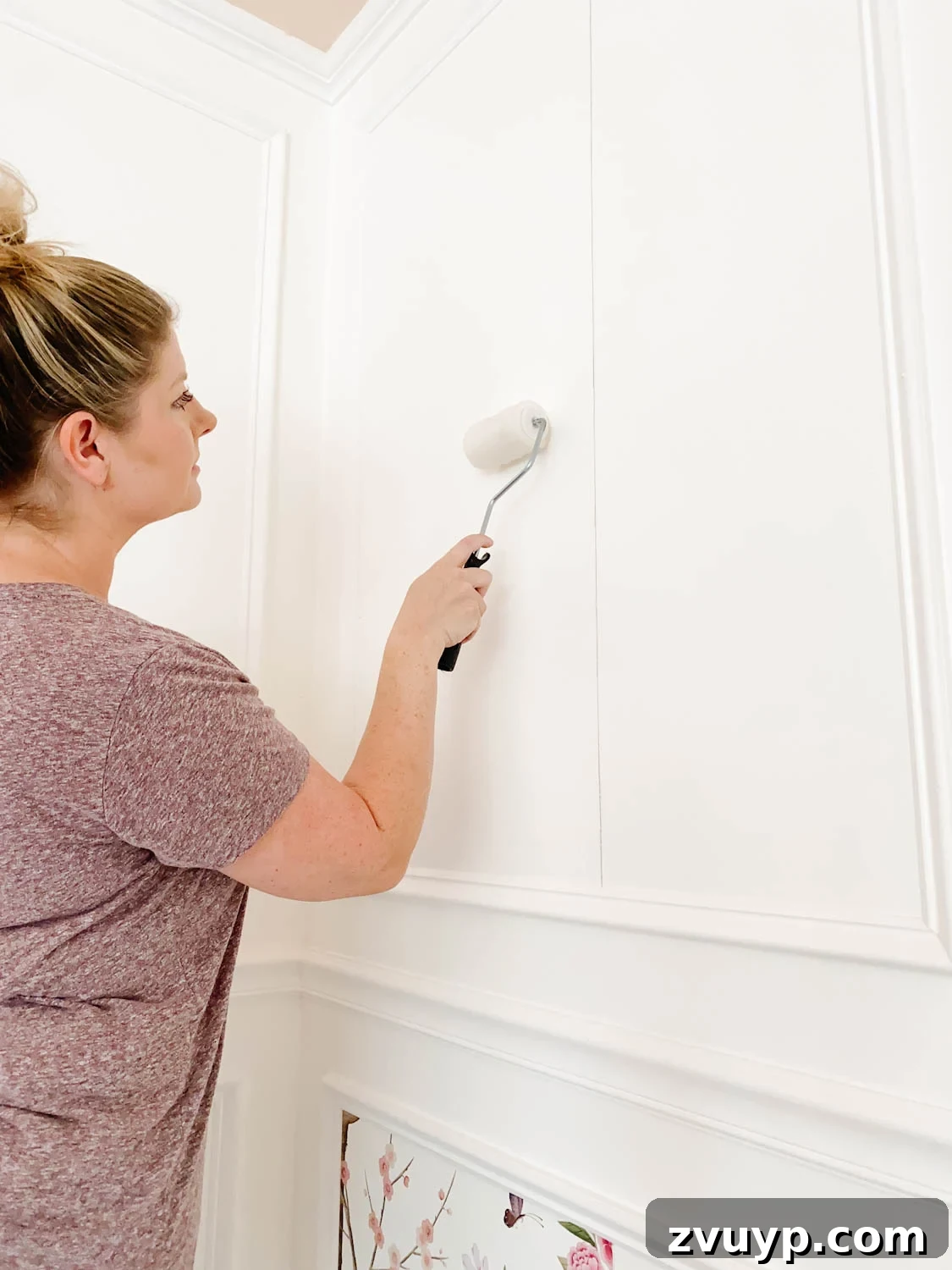 Transforming Walls with Framed Wallpaper Inserts 9 applying paste to wallpaper inside picture frame molding