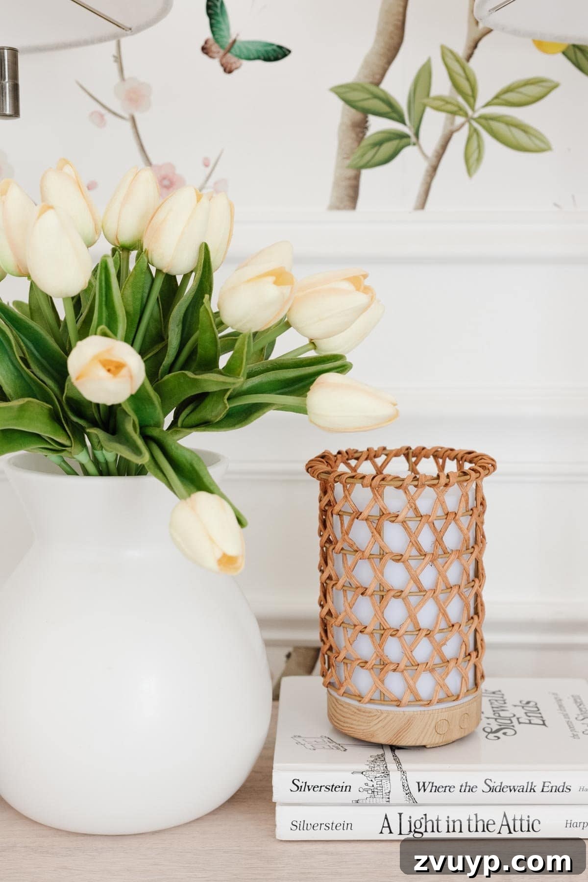 Her Enchanted Cottagecore Corner: A Toddler Room Glow-Up 12 white vase of flowers with rattan diffuser