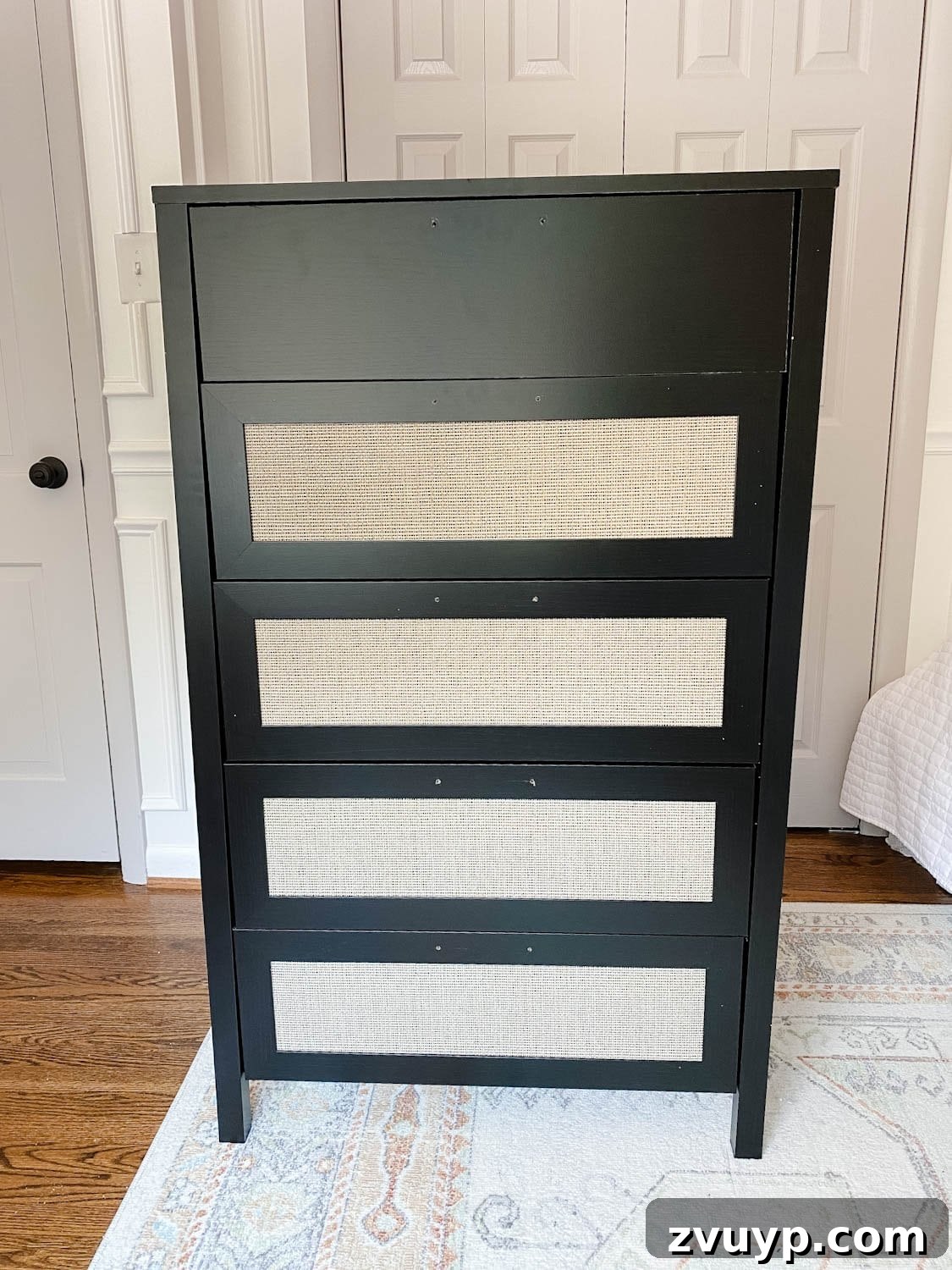 Regan's Room Transformation Painting Laminate Furniture 4 Unfinished laminate dresser with elegant cane webbing details on drawers, ready for a DIY paint transformation.