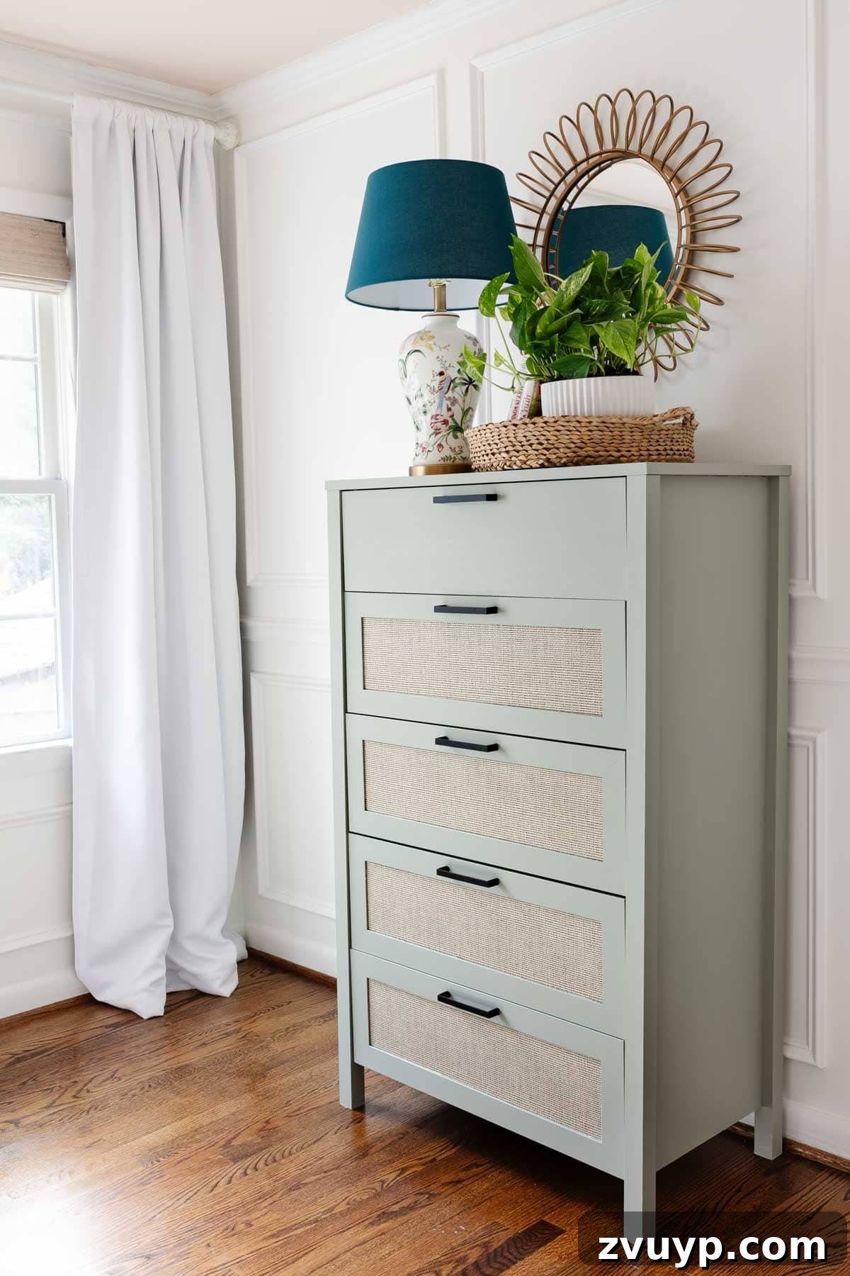Regan's Room Transformation Painting Laminate Furniture 9 Beautifully painted sage green laminate dresser in a little girl's bedroom, adorned with charming decor elements.