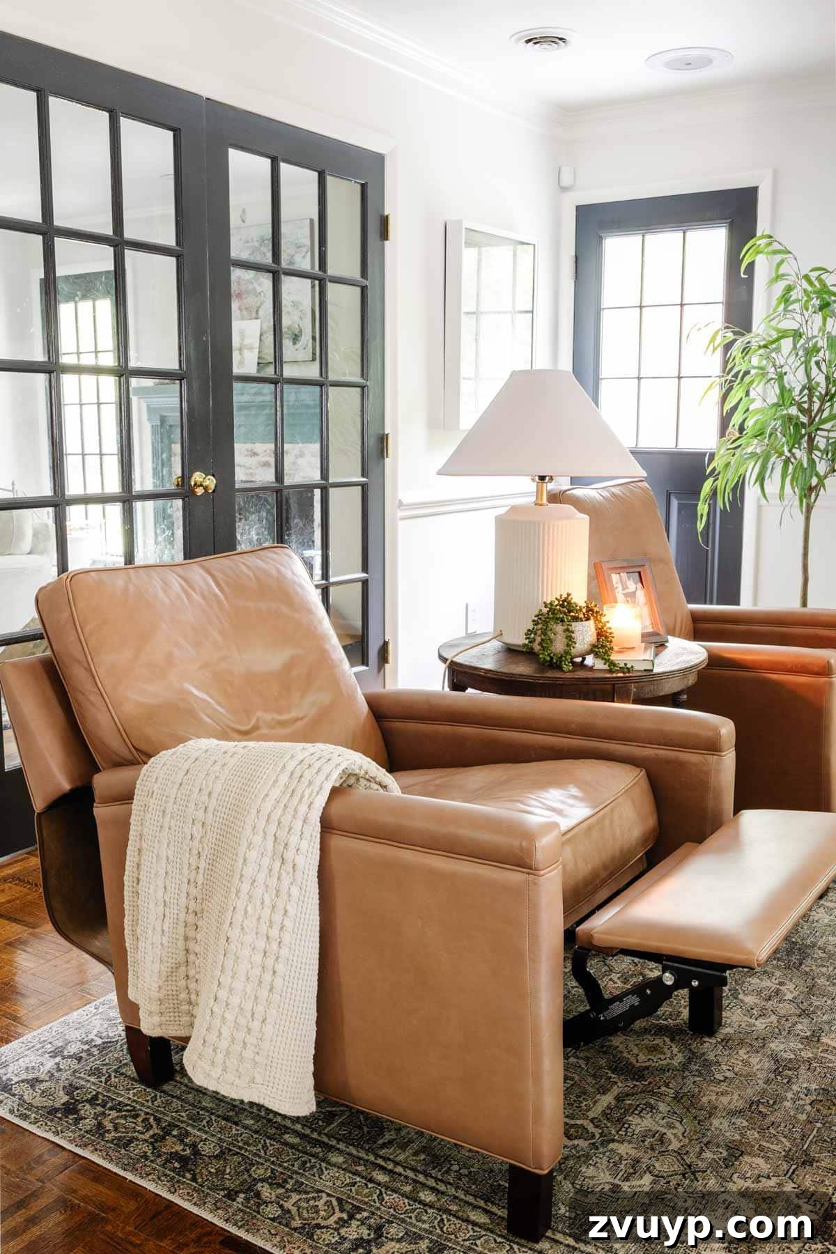 Elegant Pottery Barn Tyler square arm leather recliner, highlighting its sleek design and functionality