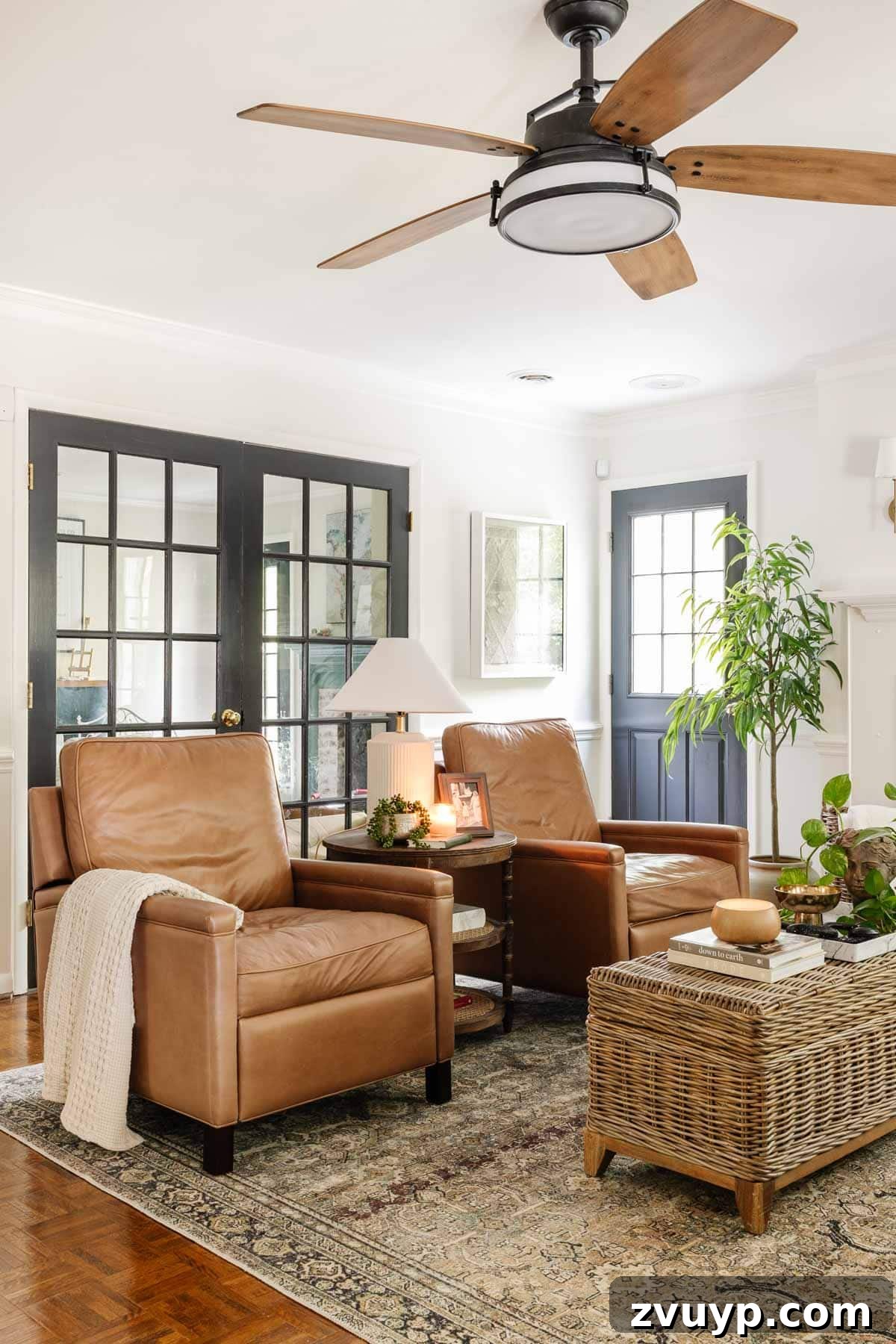 Modern high-leg leather Pottery Barn Tyler recliners enhancing a chic living room