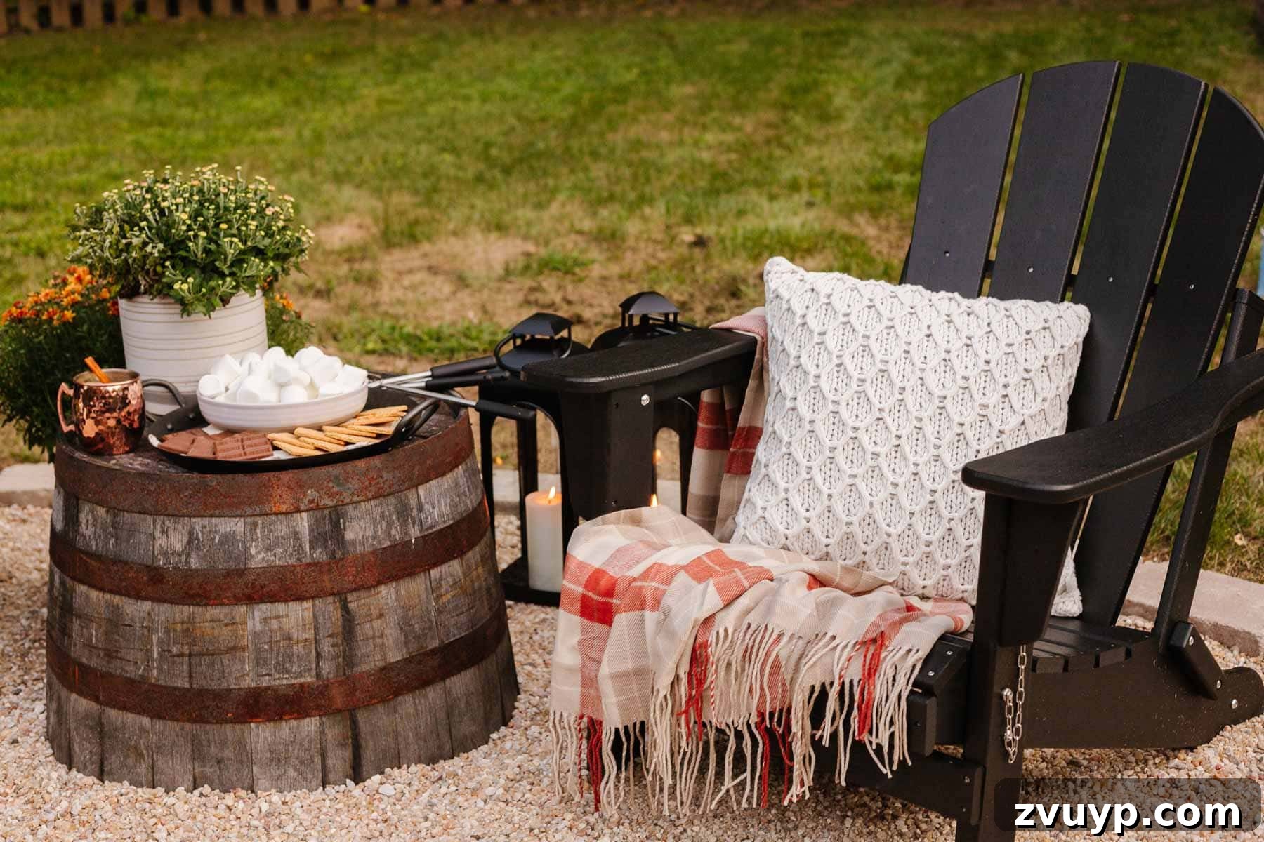Create an Epic Backyard Movie Night Without Breaking the Bank 13 adirondack chair with blanket, pillow, and barrel table with s'mores ingredients