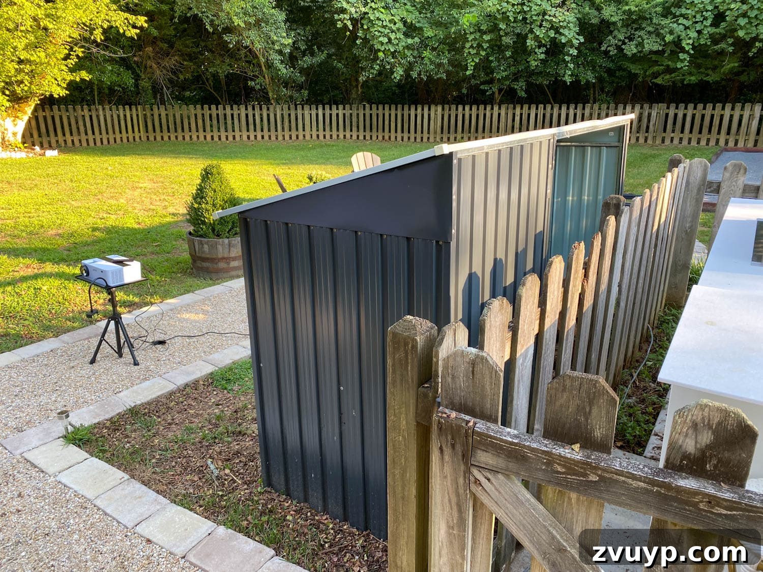 Create an Epic Backyard Movie Night Without Breaking the Bank 8 running an extension cord for an outdoor projector