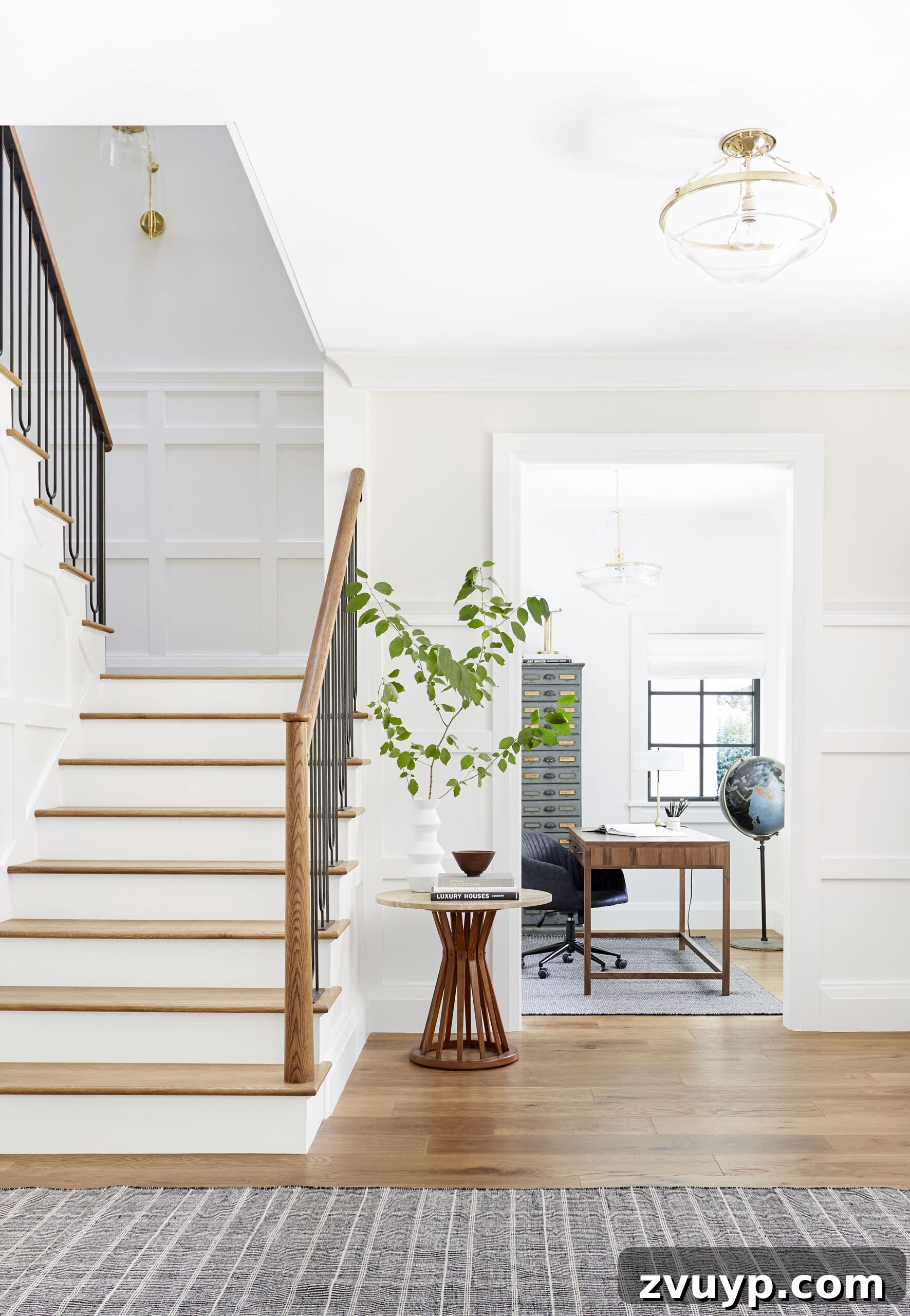 The Off White Paints Designers Swear By 10 Sherwin Williams Oyster White paint color on a dramatic entry staircase