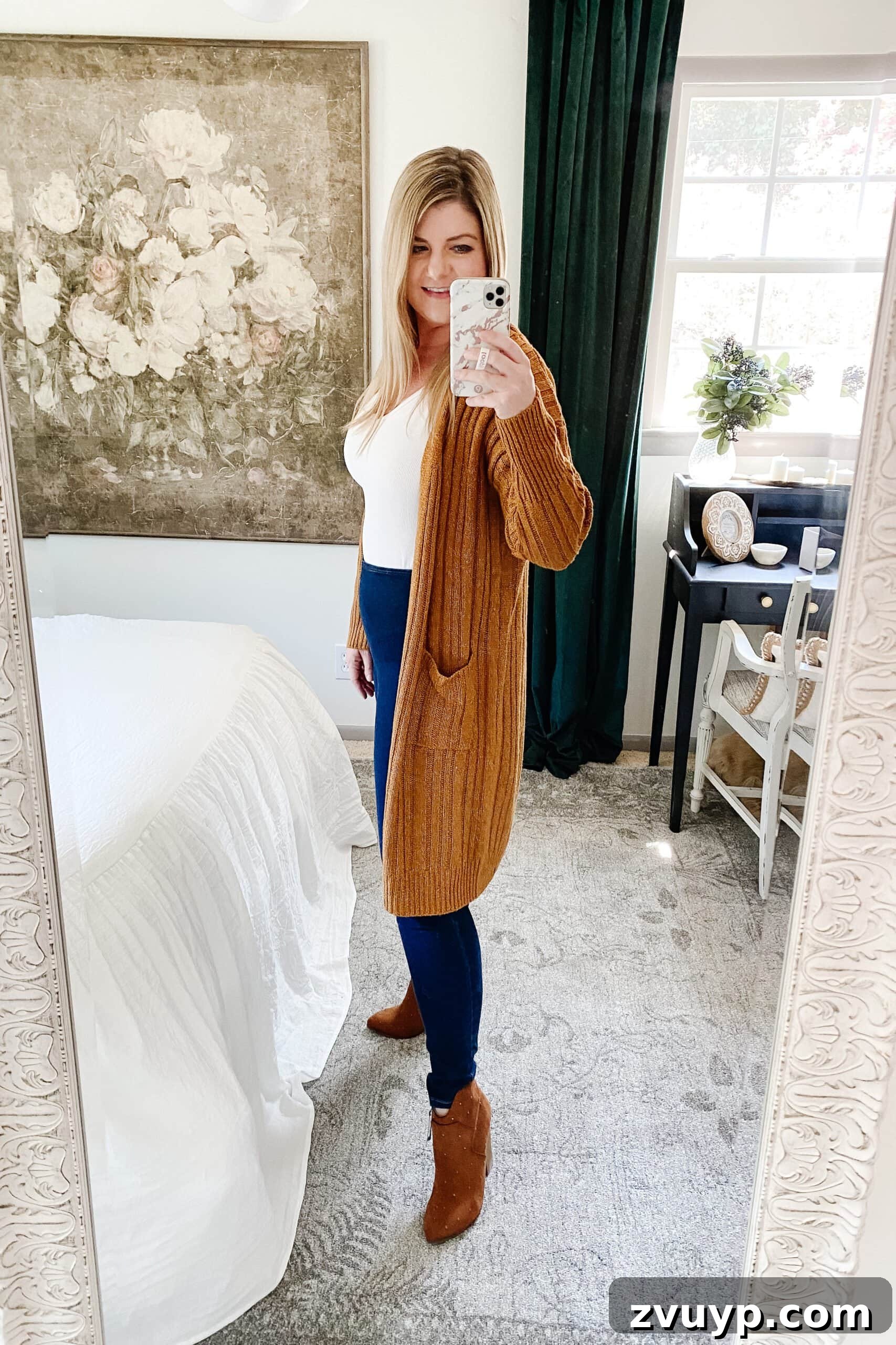 Unlock a Slimmer You: 6 Fall Outfits for Effortless Style 4 Slimming fall outfit idea: long cardigan, tucked top, dark wash high waist jeans, pointed toe boots