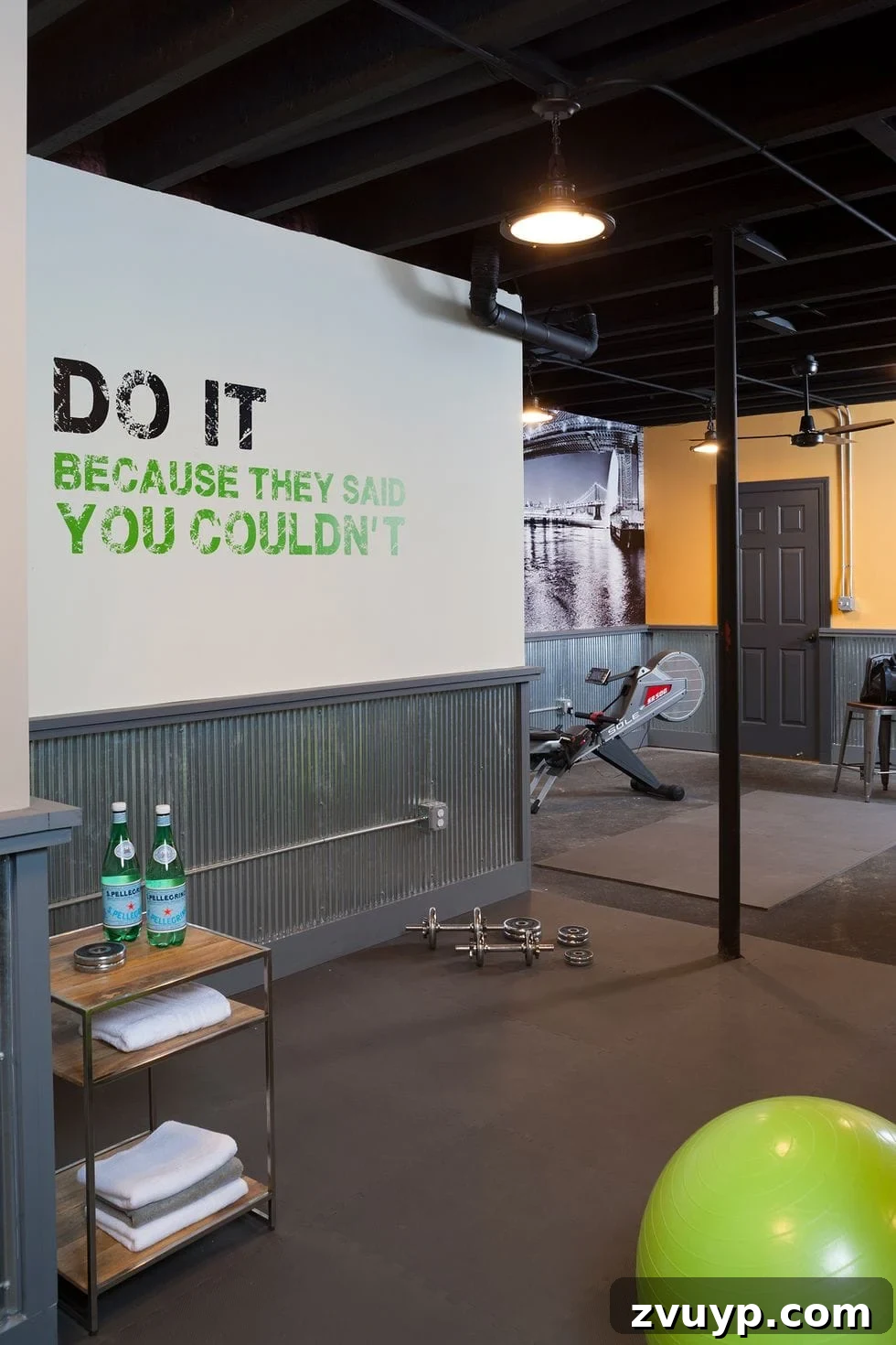 Transform Your Space: Home Gym Ideas for Basements, Garages, and Sheds 16 Home gym with a functional shelf, industrial lighting, and a wall quote mural