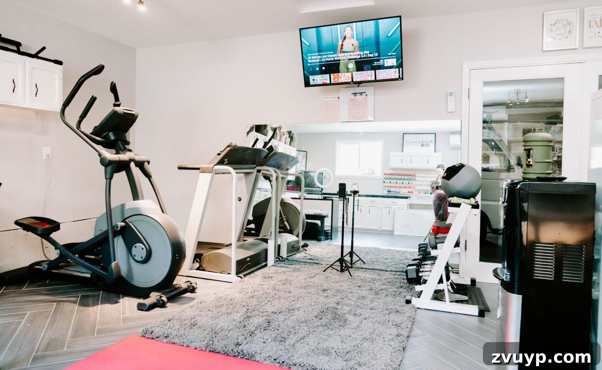 Transform Your Space: Home Gym Ideas for Basements, Garages, and Sheds 10 Workout room equipped with a large TV, full-length mirror, and area rug
