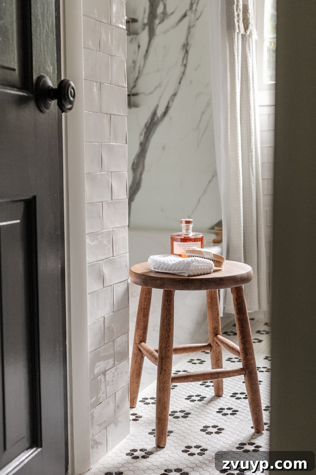 High-Contrast Haven: Black and White Bathroom Updates 17 bathroom stool with toiletries and black and white bathroom tile