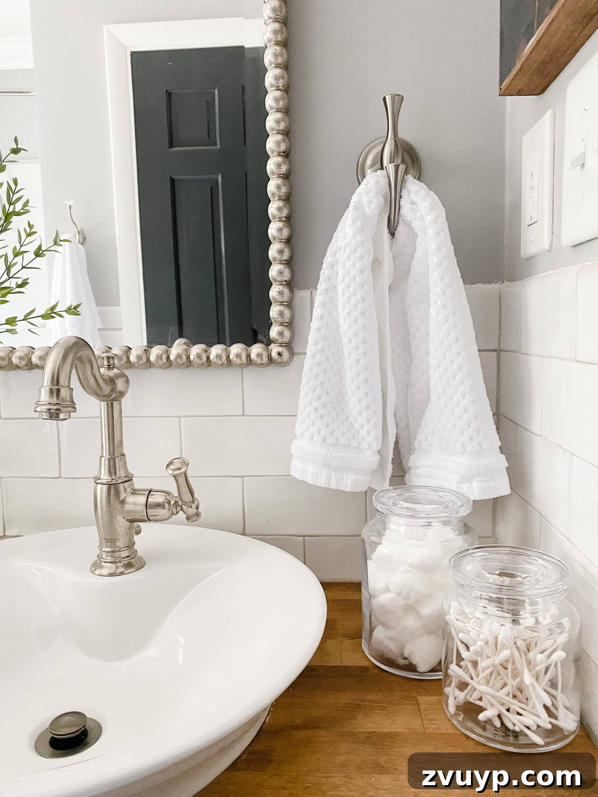 High-Contrast Haven: Black and White Bathroom Updates 8 apothecary jar bathroom accessories