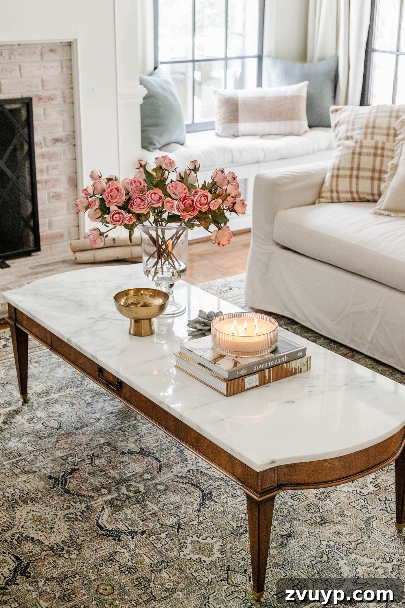 vintage marble coffee table with vase of pink roses
