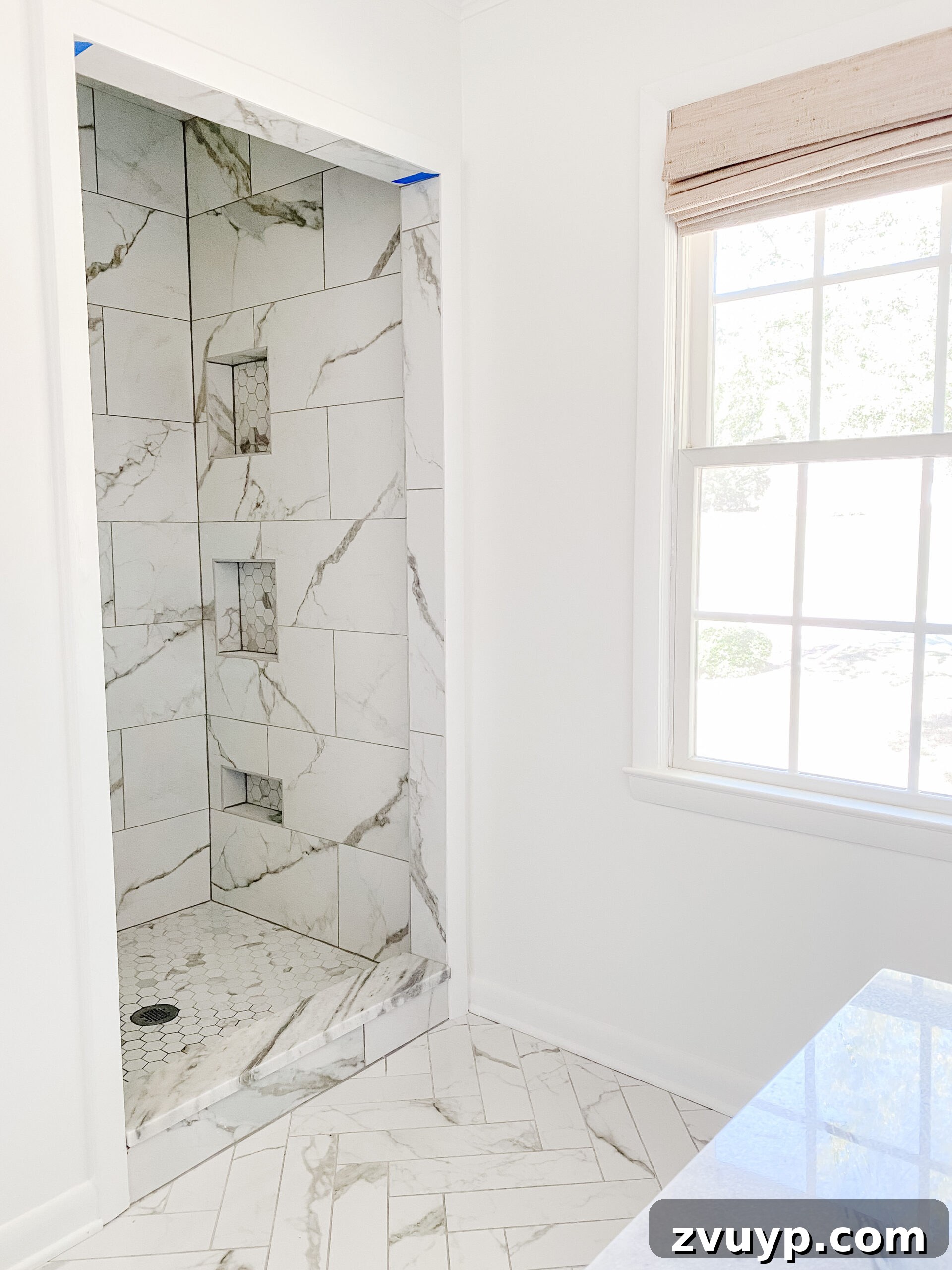 Our En Suite Bathroom Remodel: Faucets Are Finally In! 7 marble look porcelain tile shower with shower niches