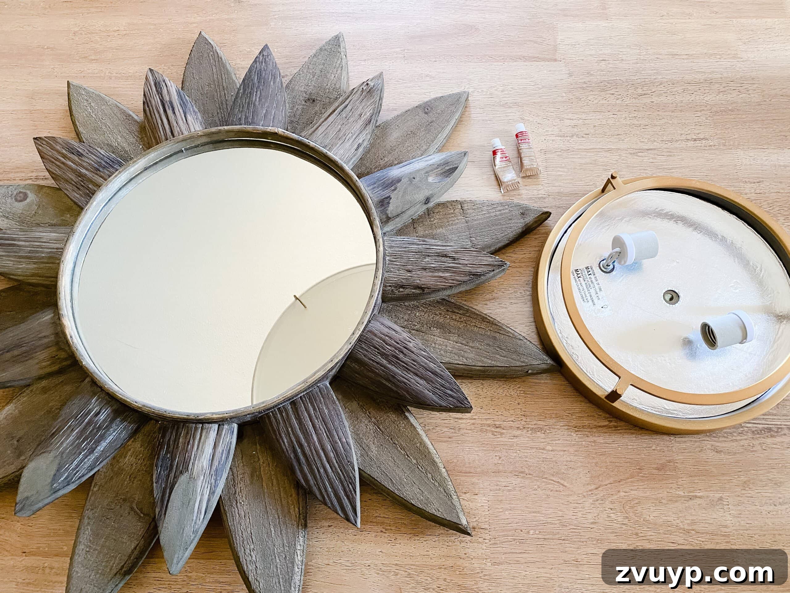 Dazzling DIY: Sunburst Mirror Light Fixture 2 A beautifully crafted DIY sunburst light fixture, combining a basic flush mount light and a sunburst mirror, creates a stunning statement piece for modern home decor.