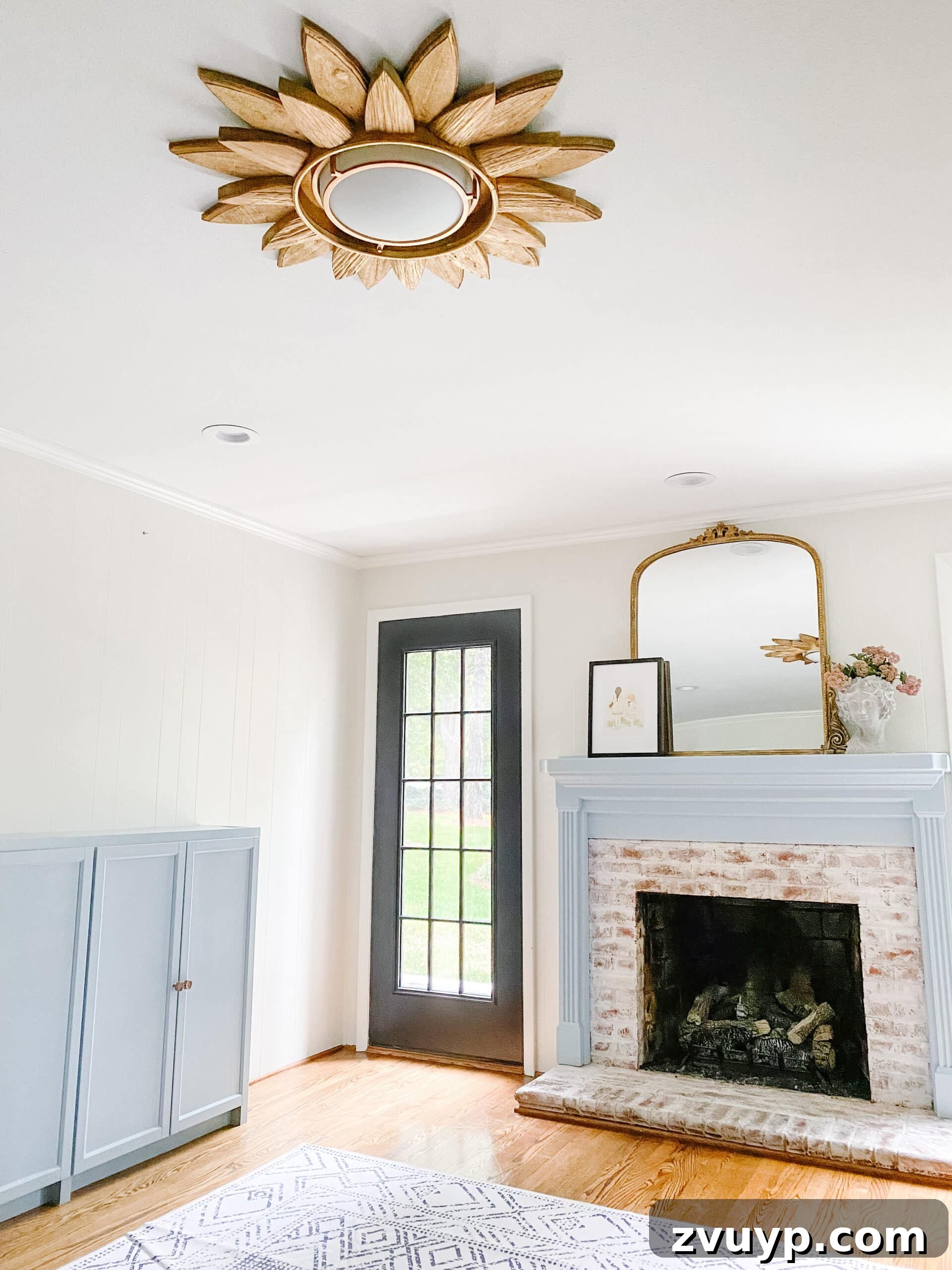 Dazzling DIY: Sunburst Mirror Light Fixture 4 The finished DIY sunburst mirror light fixture shining beautifully in a children's playroom, adding a whimsical touch.