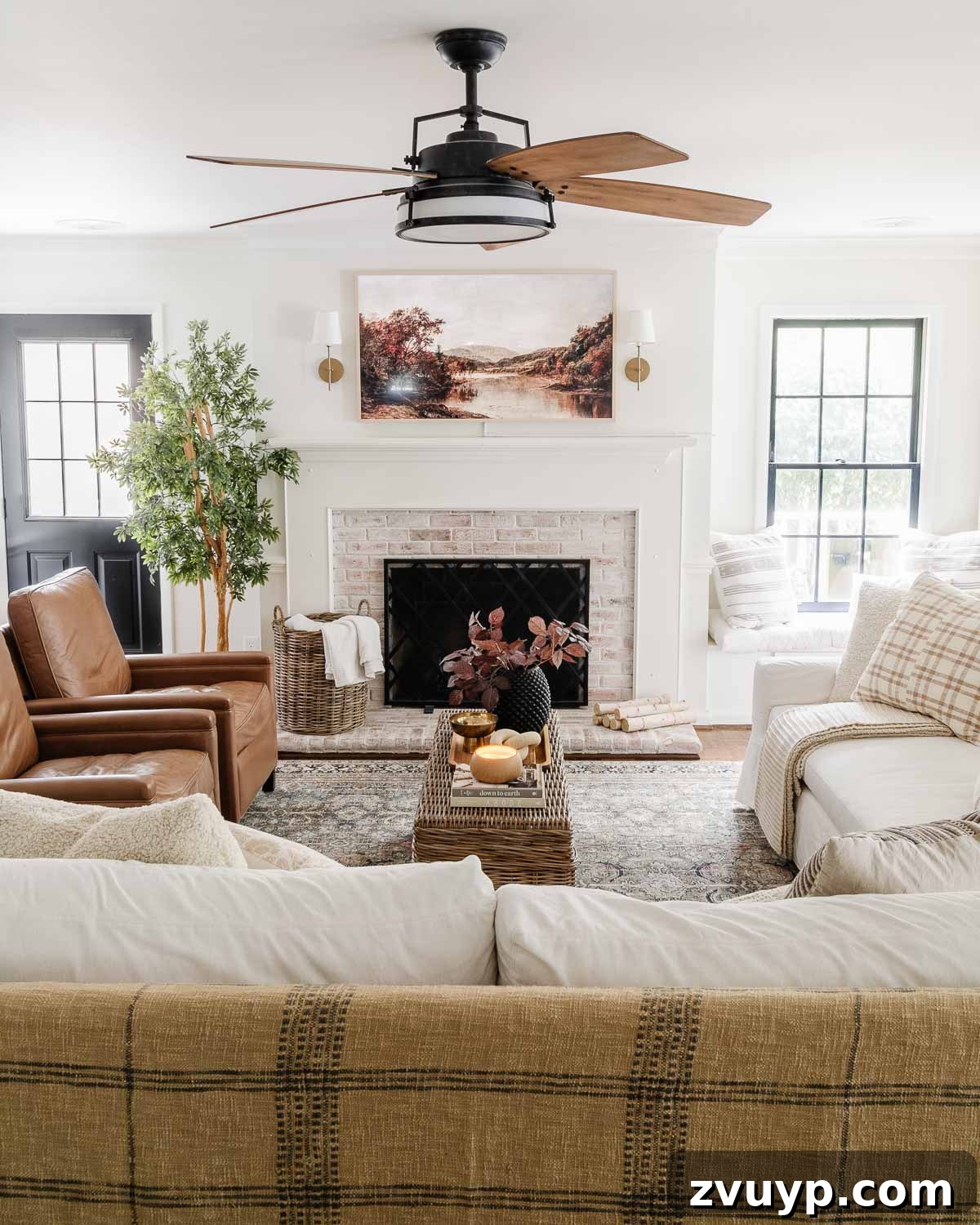 pottery barn sofa and recliners in living room with samsung frame tv