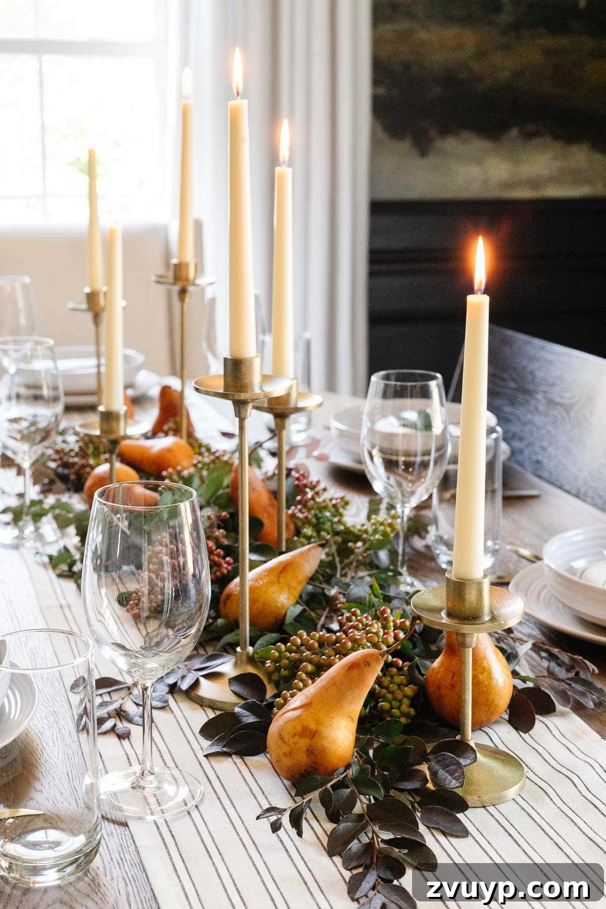 simple Thanksgiving table decor using candles, cut stems from the yard, and pears from the grocery store
