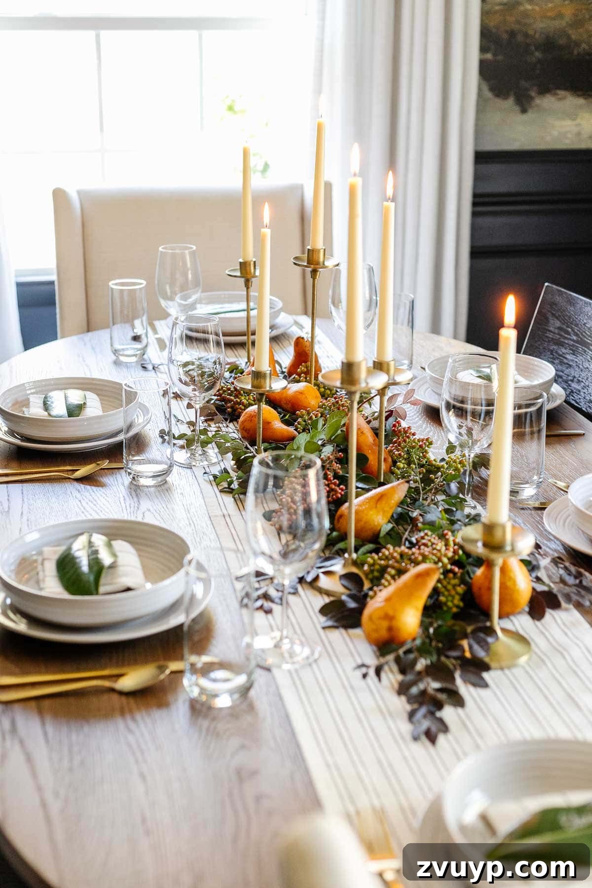 simple Thanksgiving centerpiece idea : candles, stems from the backyard, and pears