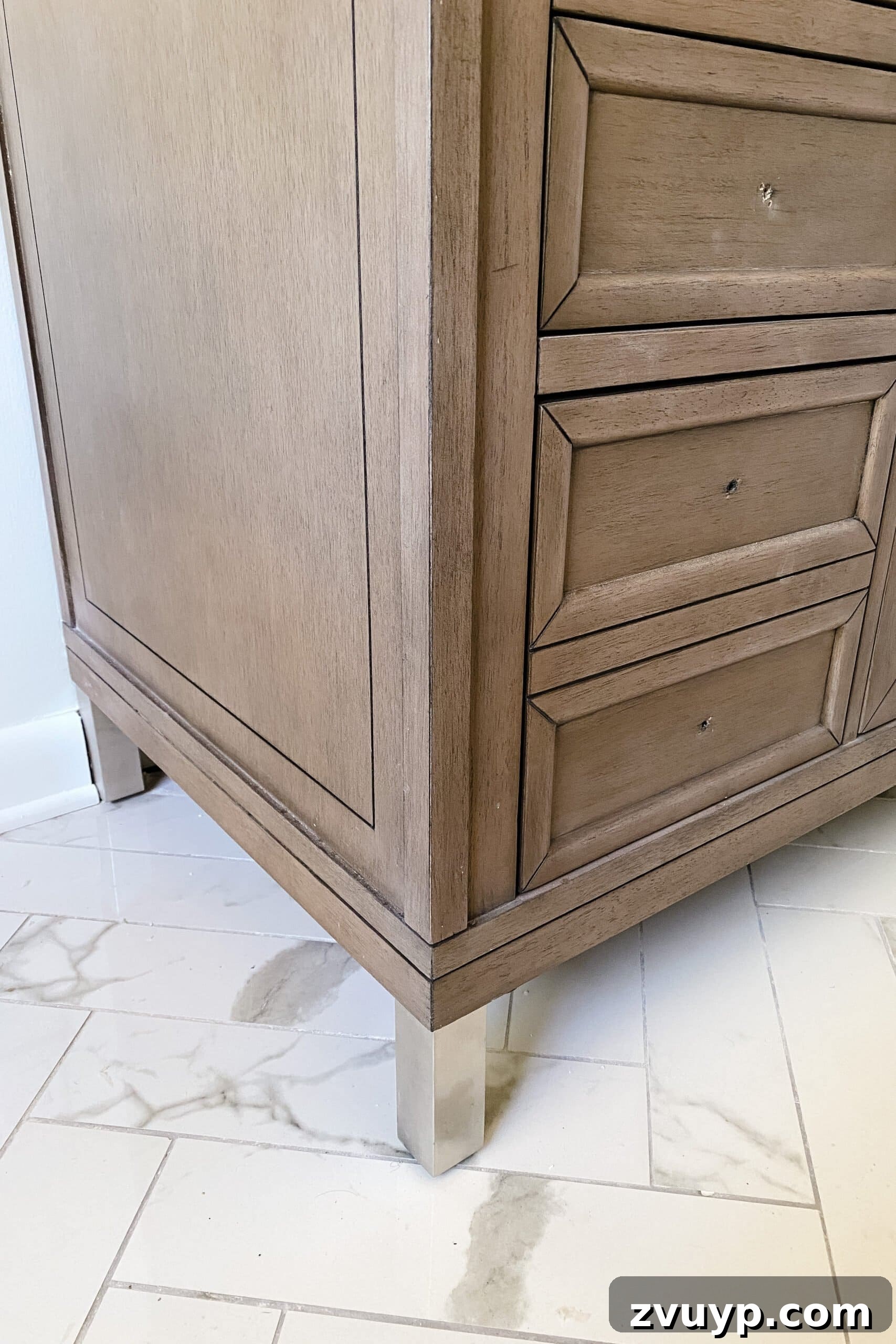 Mastering Rub n Buff: A Comprehensive Color and Technique Guide 14 Bathroom vanity leg painted with Rub n Buff, showcasing a beautiful silver metallic finish