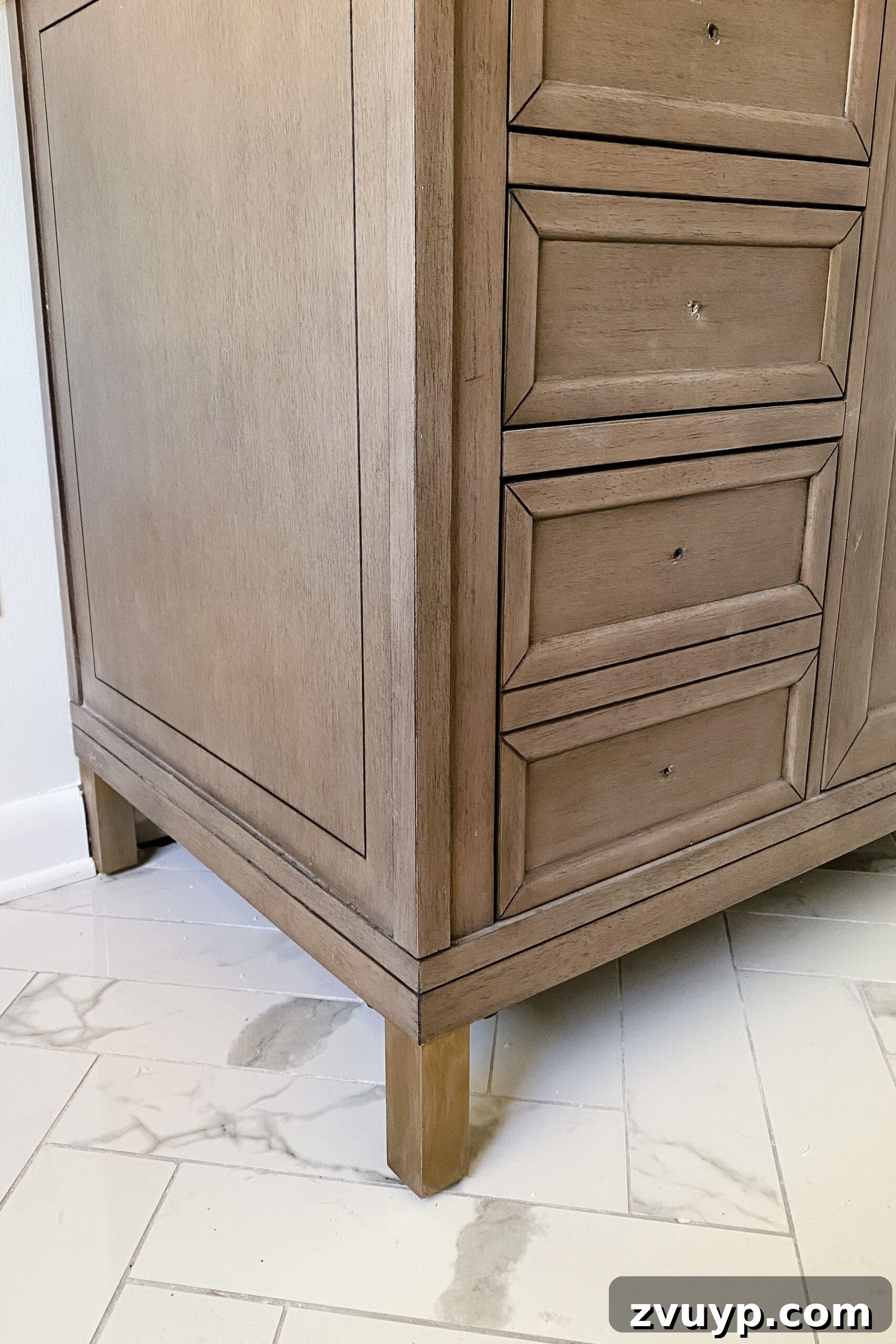 Mastering Rub n Buff: A Comprehensive Color and Technique Guide 15 Bathroom vanity leg painted with Rub n Buff, showcasing a refined gold metallic finish
