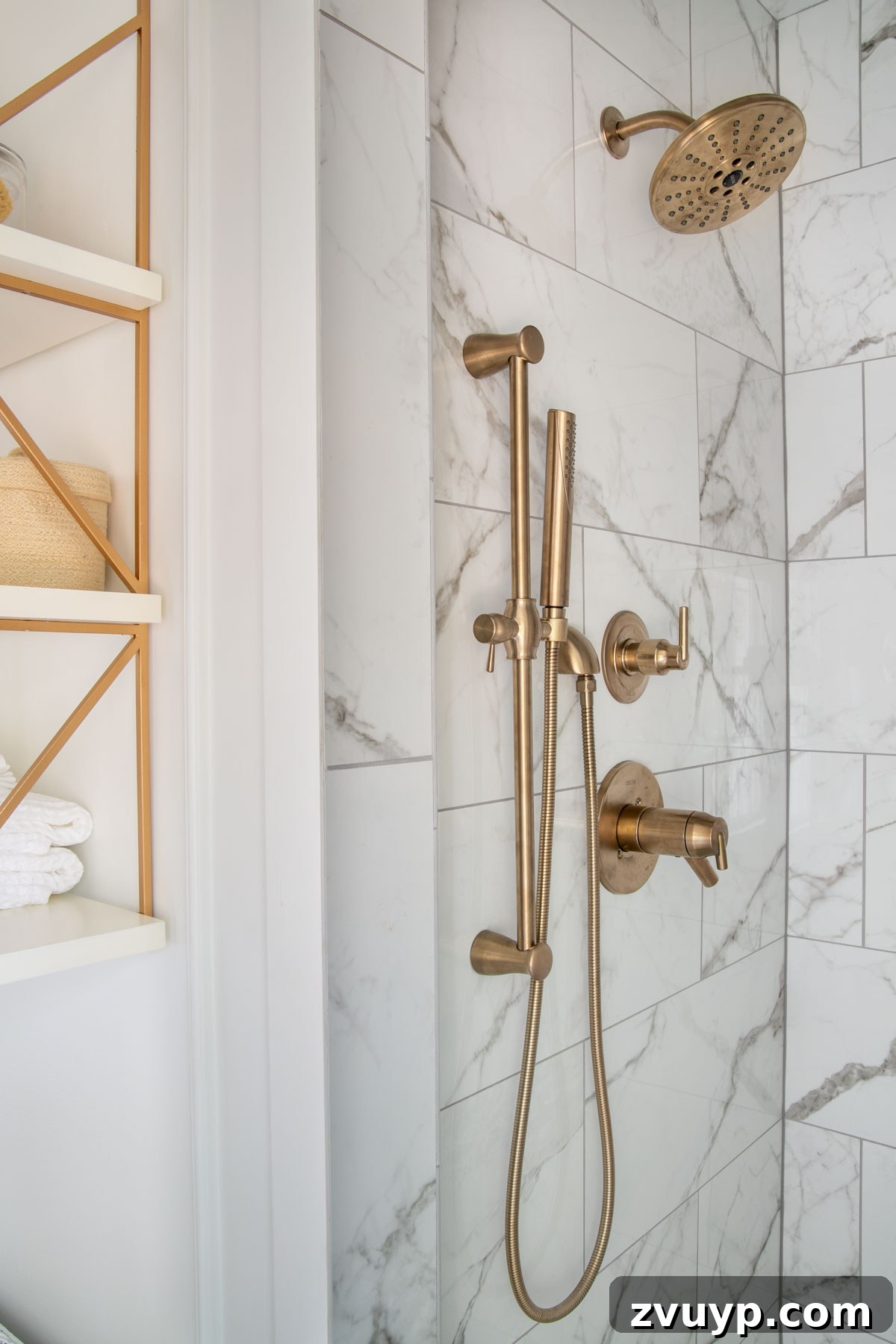 The Perfect Blend: Modern Vintage En Suite Bathroom Tour 19 Delta Champagne Bronze shower faucet with a convenient handheld showerhead and slide bar, exuding modern elegance